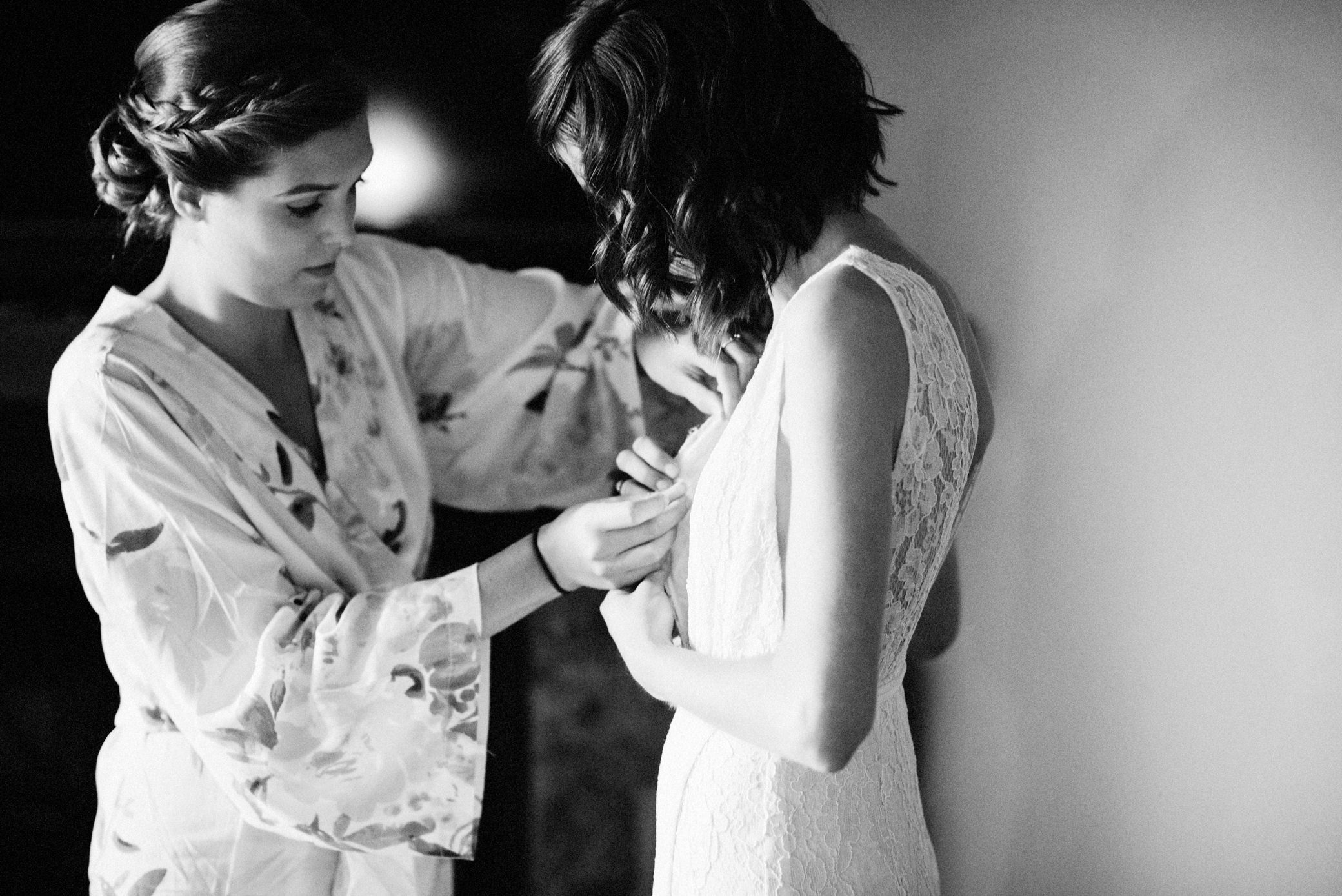 Zoe's sister helps her get dressed for her wedding at Willows Lodge, Washington, Summer 2016
