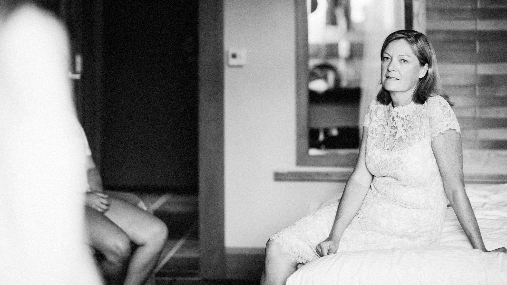 Zoe's mom watches her daughters get dressed for Zoe's wedding, at Willows Lodge, Summer 2016