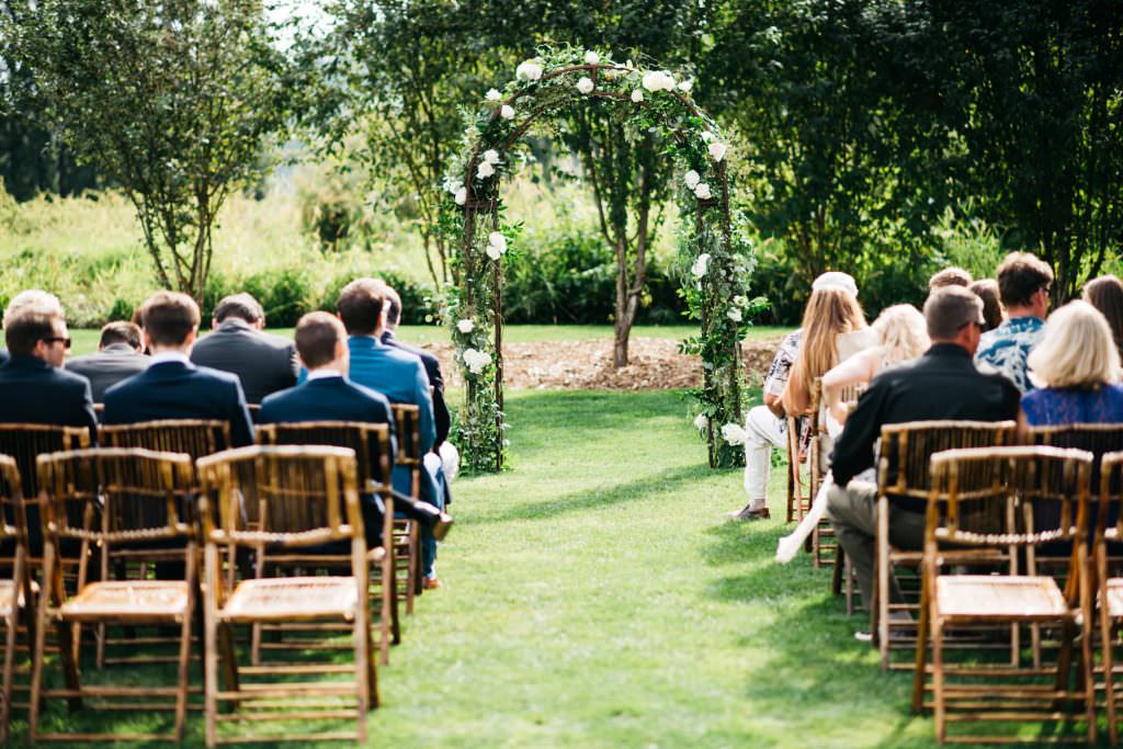 Guests wait for Daniel and Zoe to walk down the aisle at Woodinville Lavender Farm, Washington, summer 2016