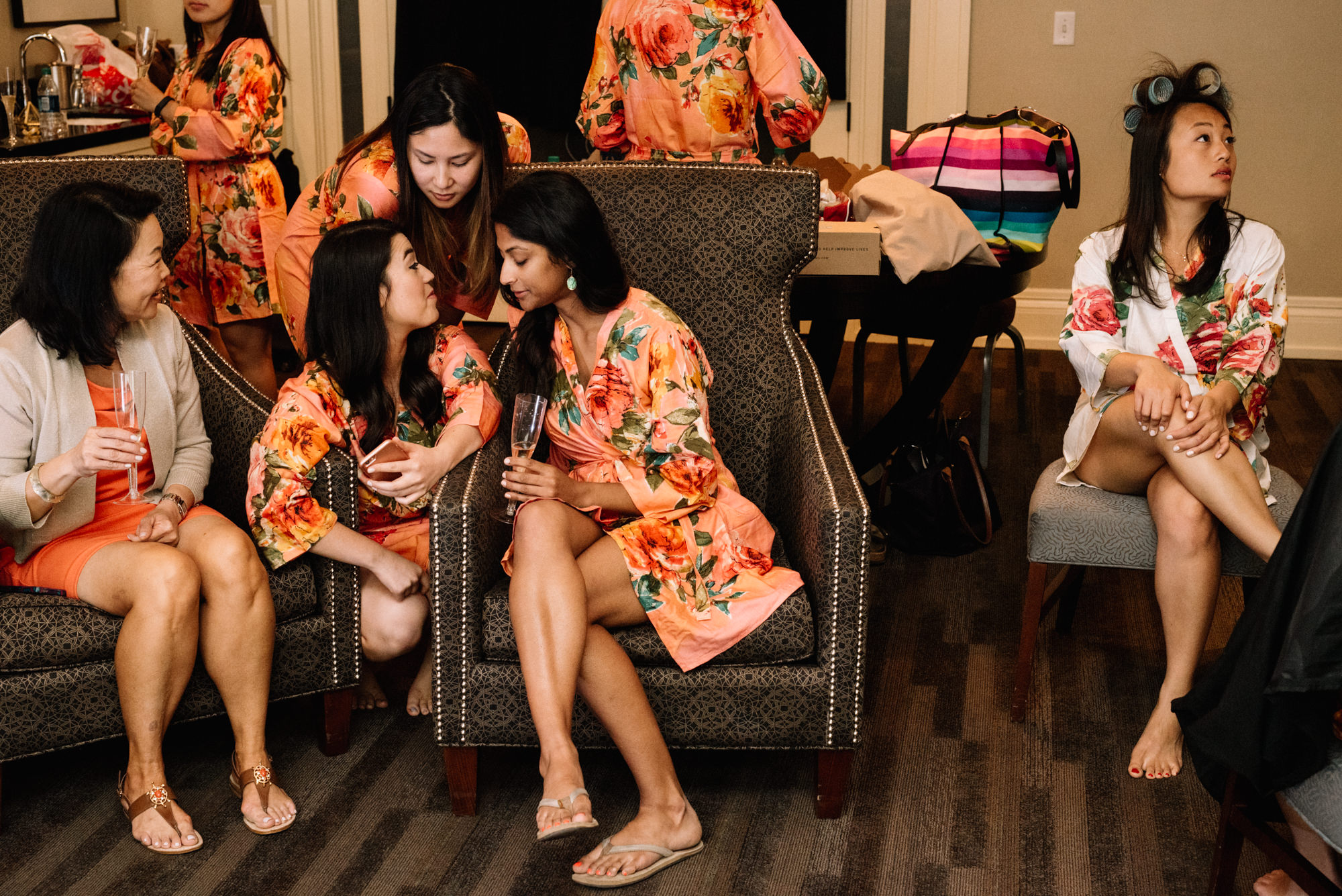 Bridesmaids and bride hang out while getting ready for Amy and Jeremy's big day. Alexis Hotel, Seattle WA. 