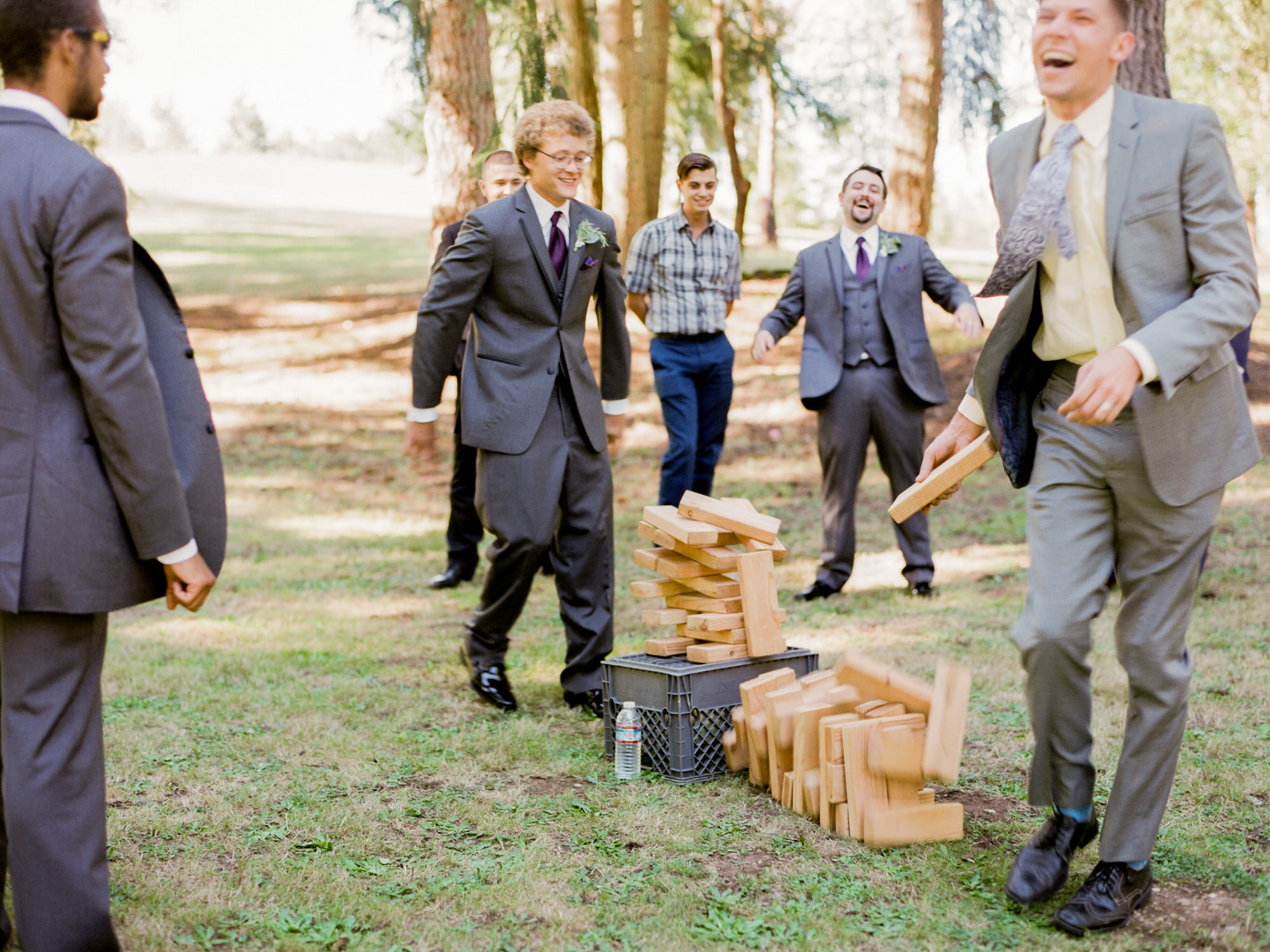 Guests playing with the giant Jenga at Katherine and Graeme's wedding at Kingston House, WA.