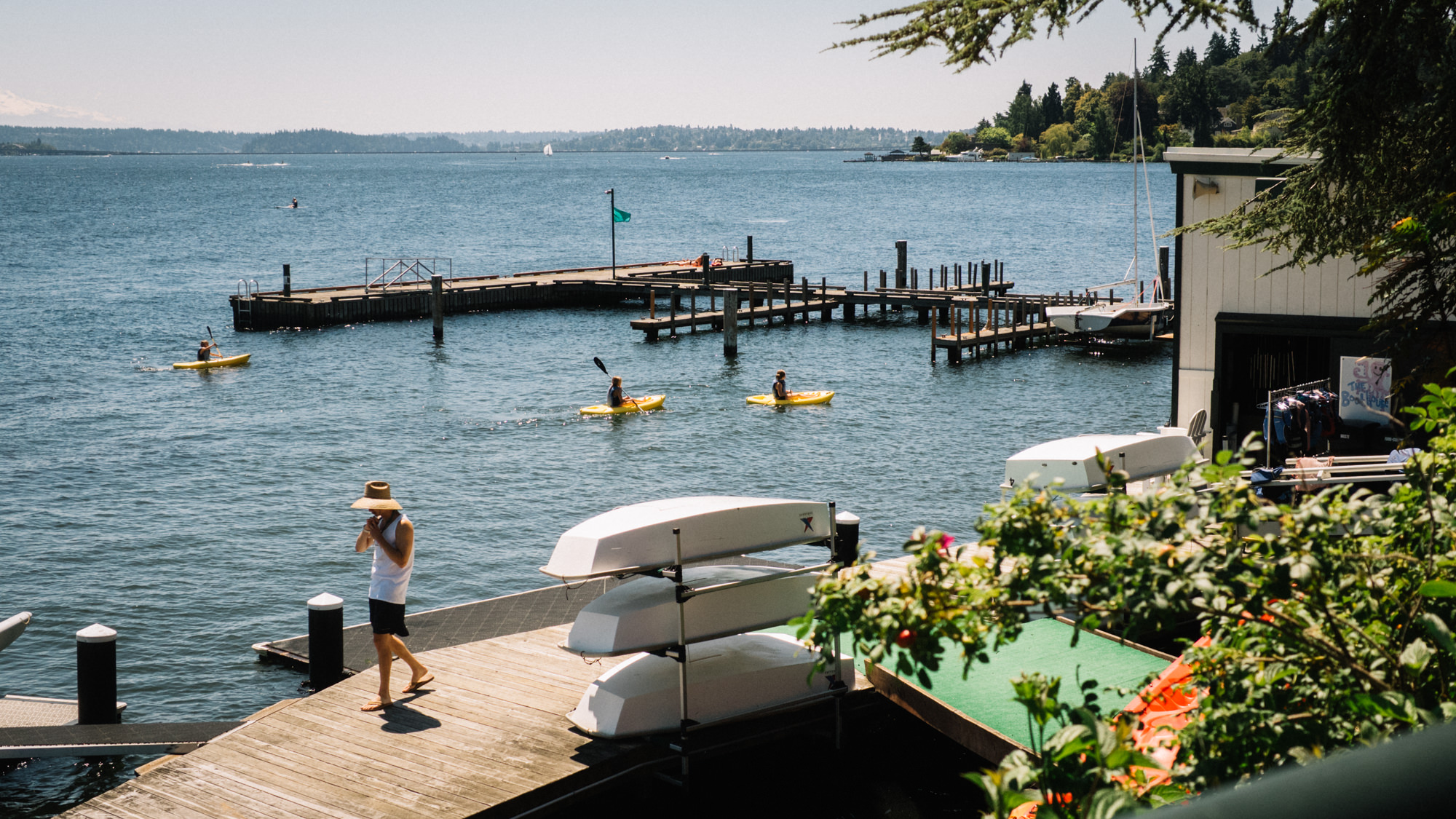 Club members kayaking at the Seattle Tennis Club, a sports club and wedding venue in Seattle, WA. Summer 2016. Photo by Seattle Wedding Photographers Jennifer Tai Photo Artistry.