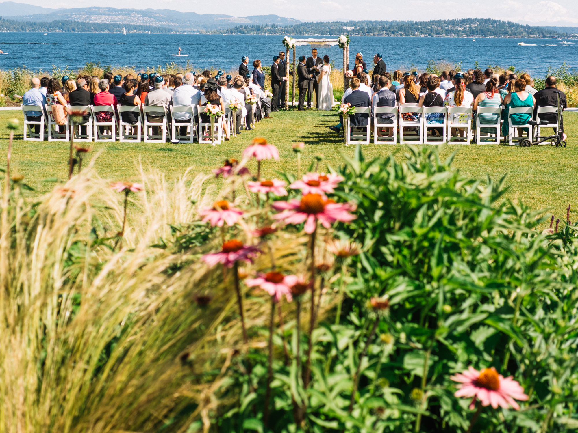 The Seattle Tennis Club features gorgeous water views and lovely landscaping on their ceremony grounds. Summer 2016. Photo by Seattle Wedding Photographers Jennifer Tai Photo Artistry.