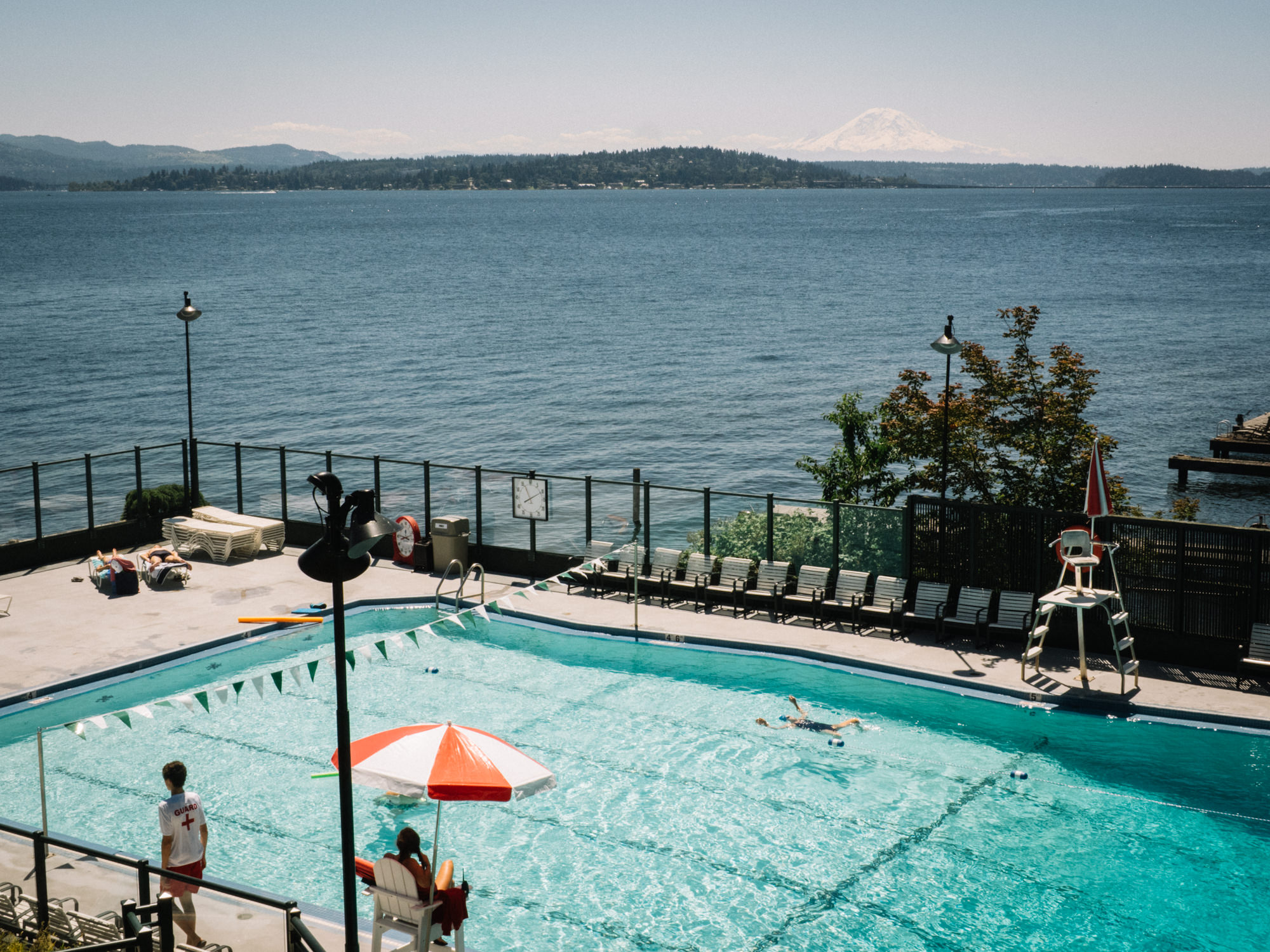Club members swimming at the Seattle Tennis Club, a sports club and wedding venue in Seattle, WA. Summer 2016. Photo by Seattle Wedding Photographers Jennifer Tai Photo Artistry.