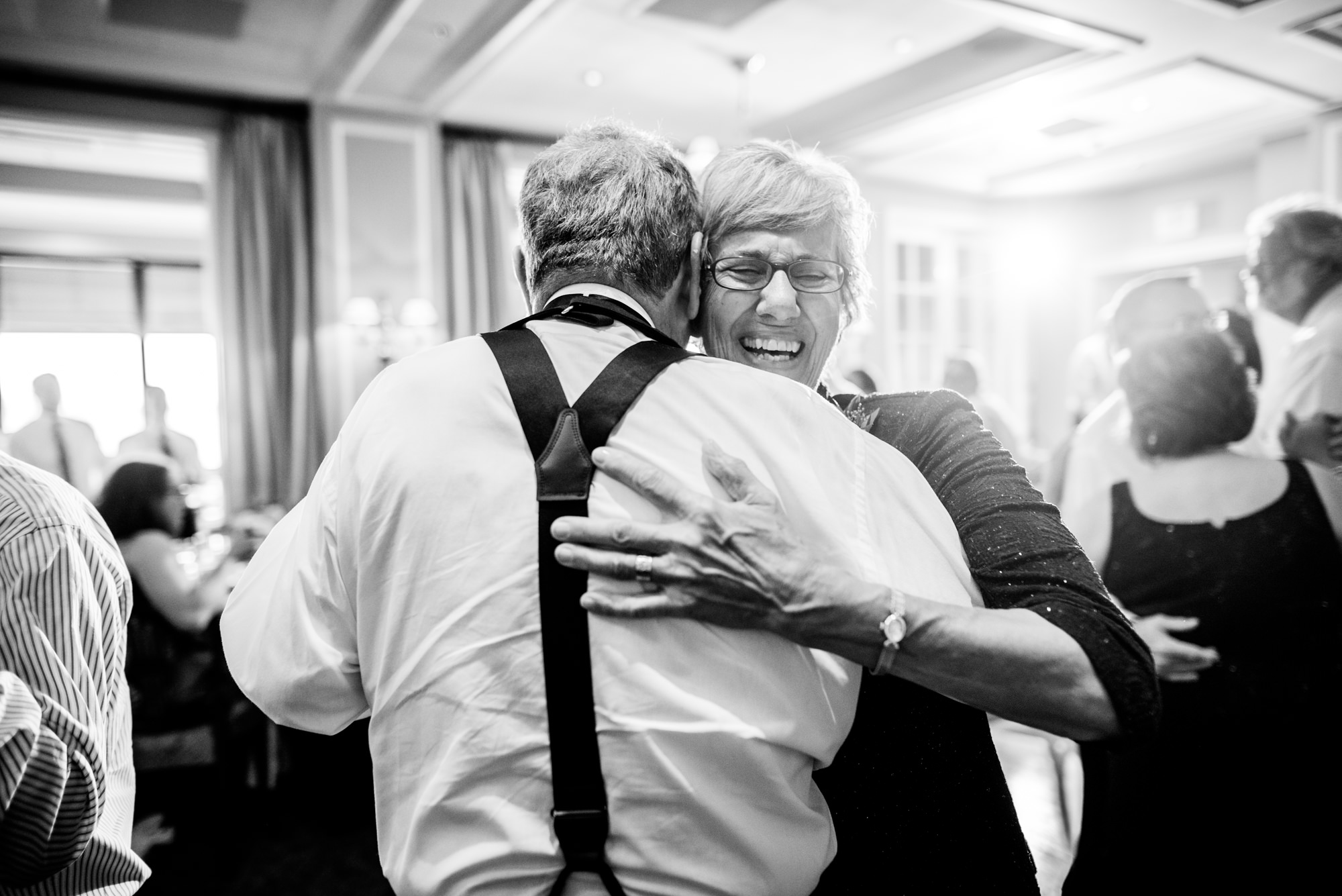 Joelle's parents participate in the "generational" dance portion of Joelle and Ryan's wedding reception at the Seattle Tennis Club, summer 2016. Photo by Seattle Wedding Photographers Jennifer Tai Photo Artistry.