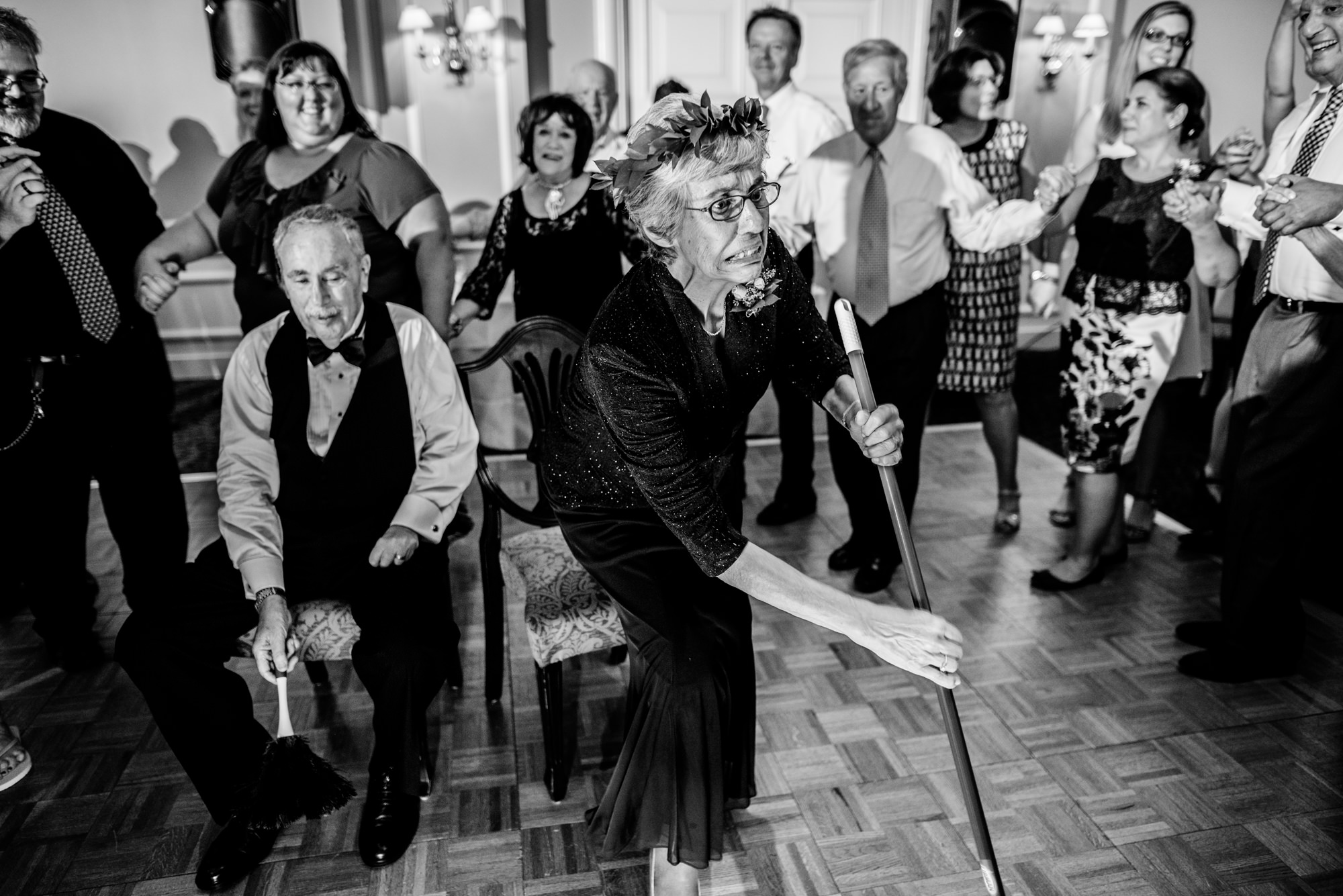 The Mizinke Dance is a celebratory Jewish tradition signifying that the youngest of the family has been married off, performed by Joelle's parents. Seattle Tennis Club. Summer 2016. Photo by Seattle Wedding Photographers Jennifer Tai Photo Artistry.