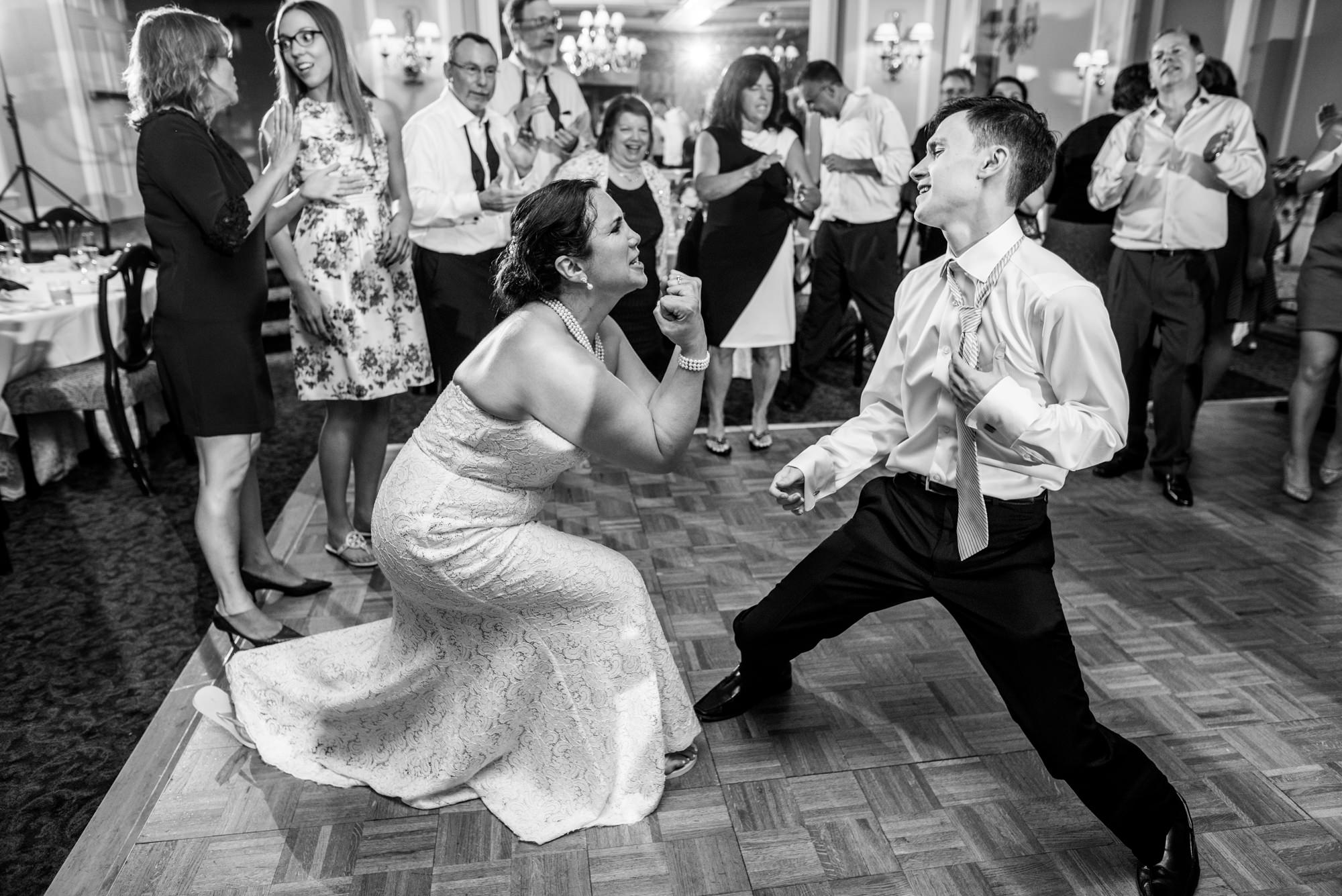 The happy couple dance into the night with their wedding guests at the Seattle Tennis Club, summer 2016. Photo by Seattle Wedding Photographers Jennifer Tai Photo Artistry.