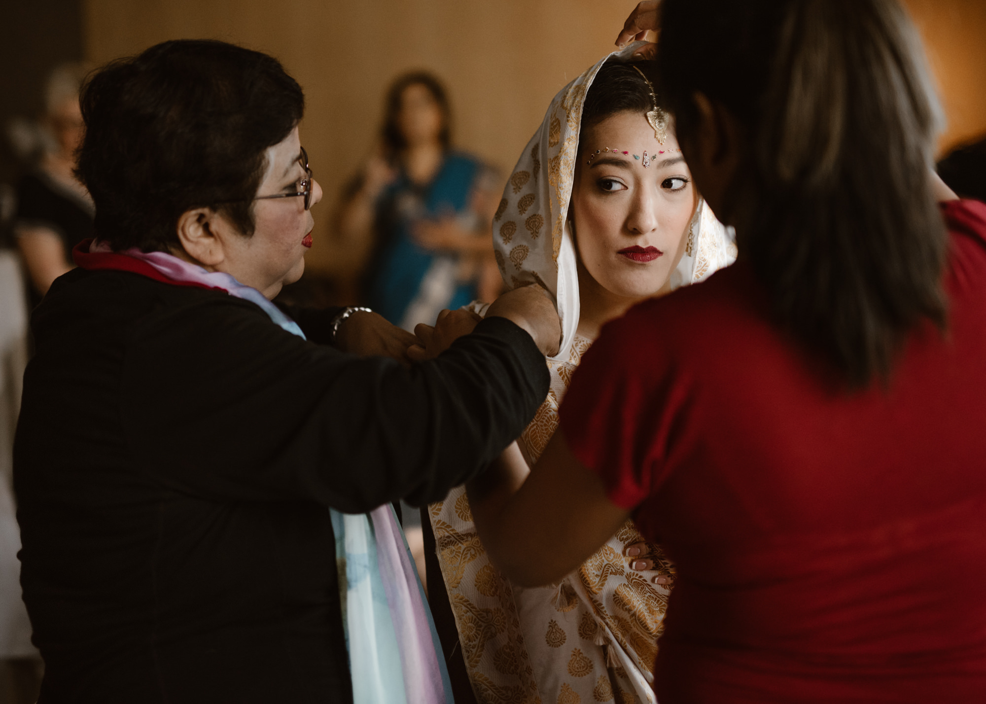 Julie getting her saree tied for her wedding at the Four Seasons Hotel, Seattle.