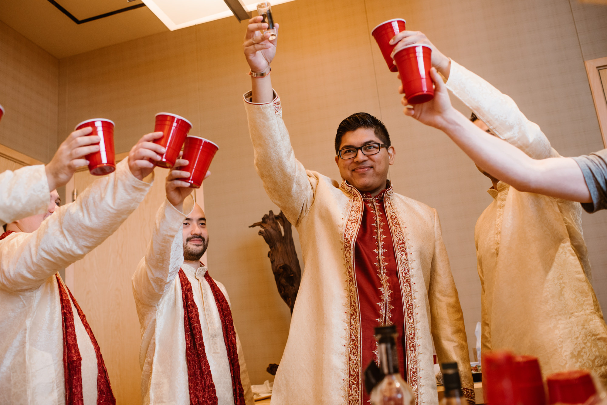 Neel and his groomsmen toast to his wedding at the Four Seasons Hotel, Seattle WA. 