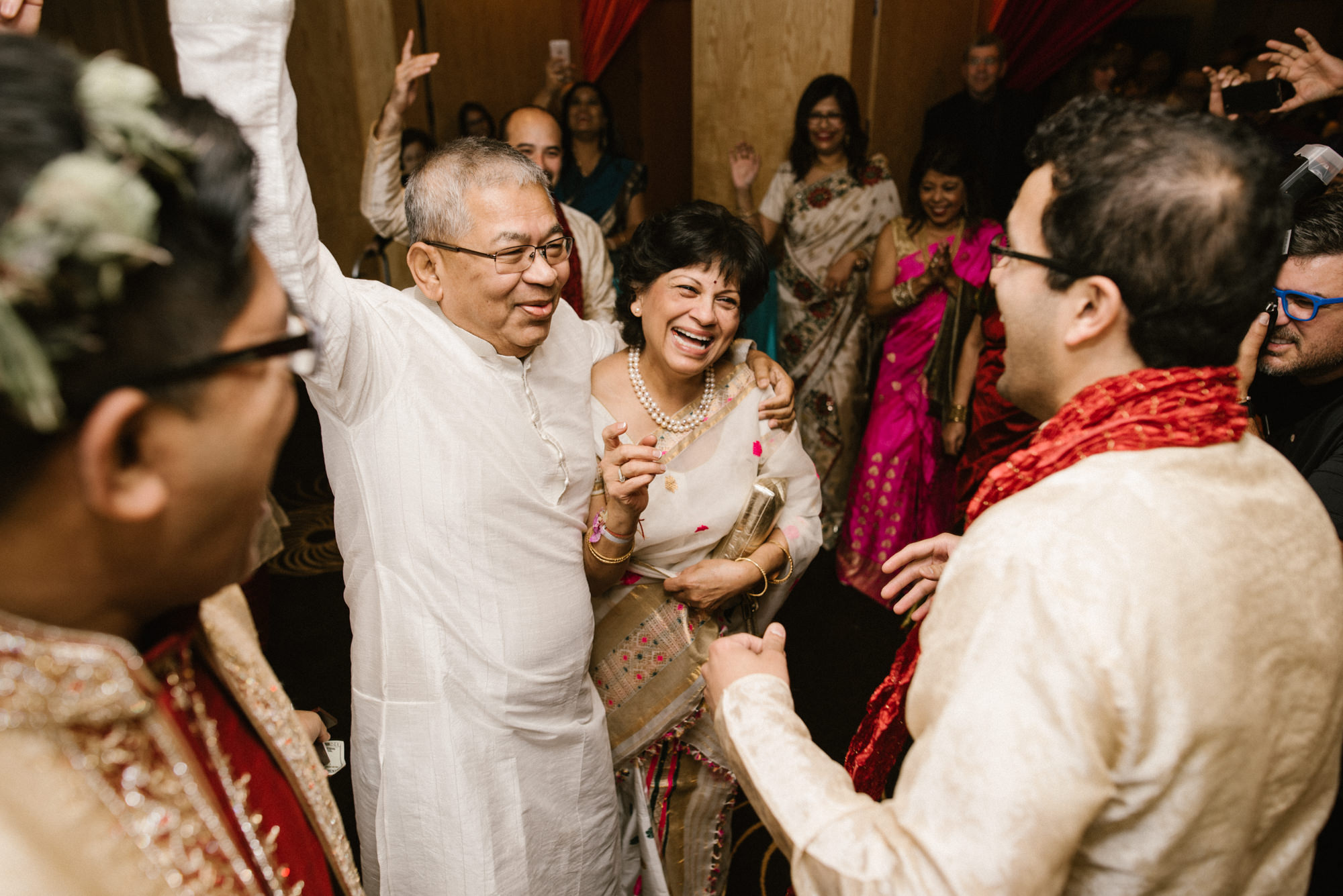 Neel's parents join the celebration and arrival of their son to his Hindu wedding at the Four Seasons.