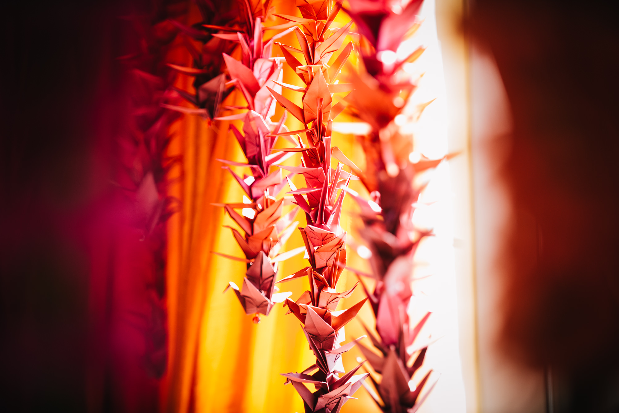 Origami cranes, a Japanese wedding tradition, decorating the dias where the Hindu ceremony will be performed at Julie and Neel's wedding at the Four Seasons Hotel, Seattle.