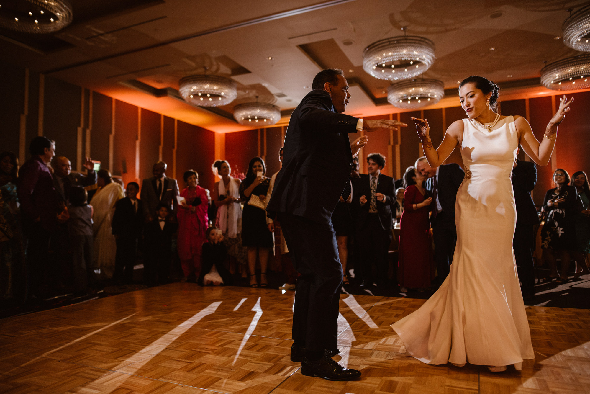 Julie dances with a favorite uncle at her wedding reception at the Four Seasons