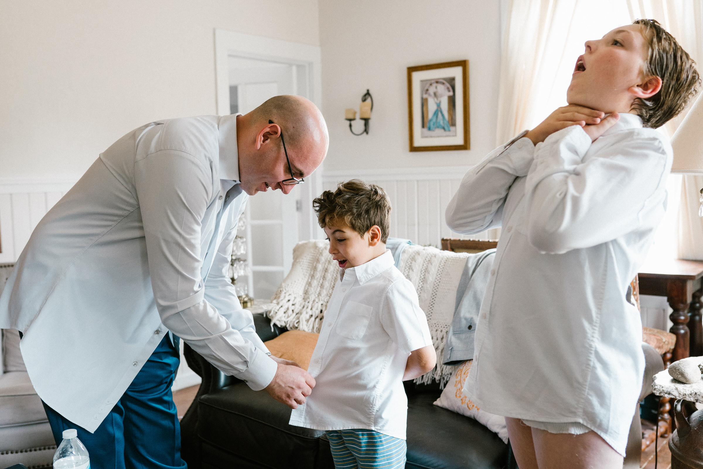 Wayfarer Whidbey Island Wedding: Funny candid of the groom and his sons getting ready.