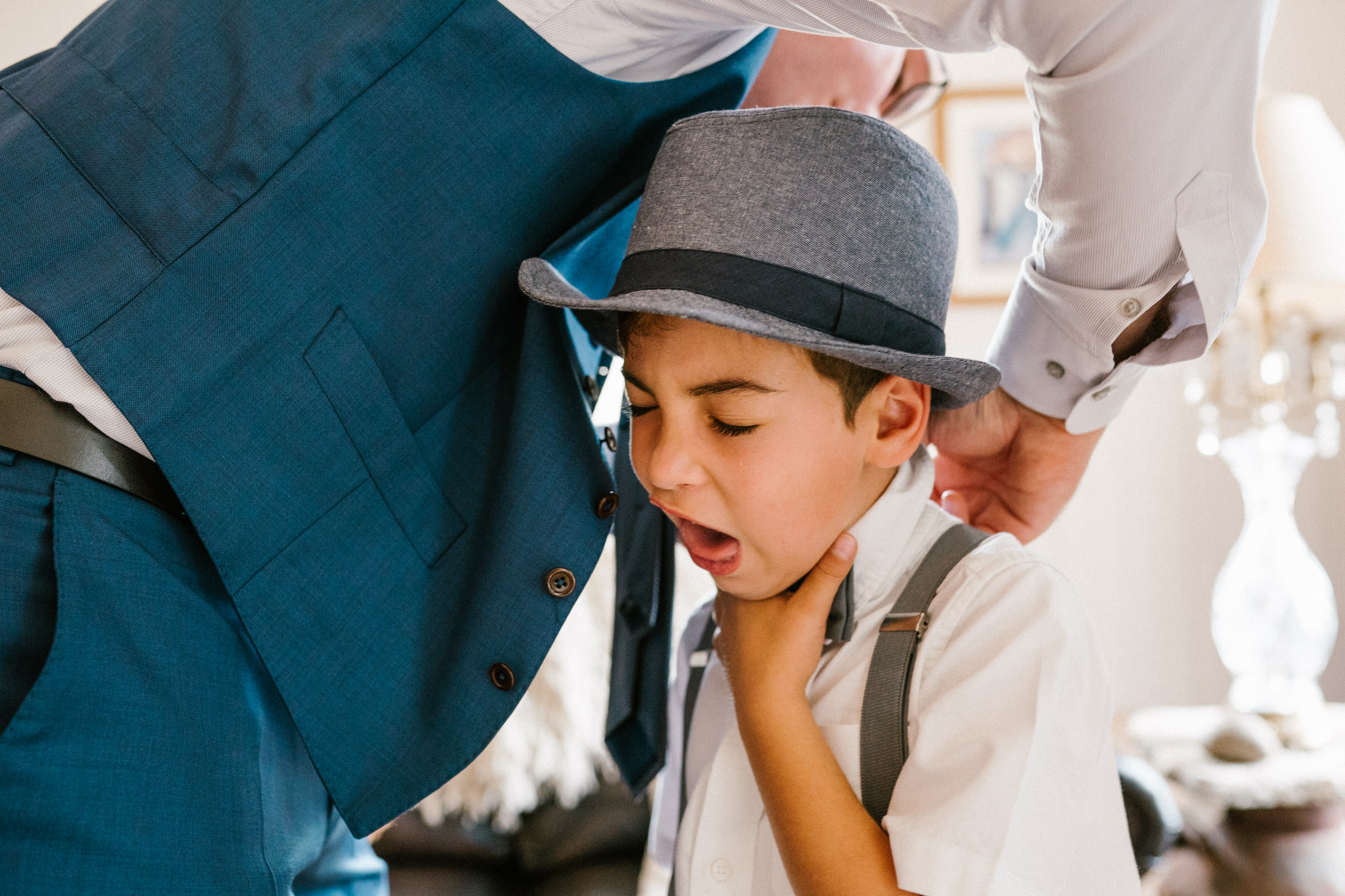 Wayfarer Whidbey Island Wedding: Funny candid of the groom and his sons getting ready.