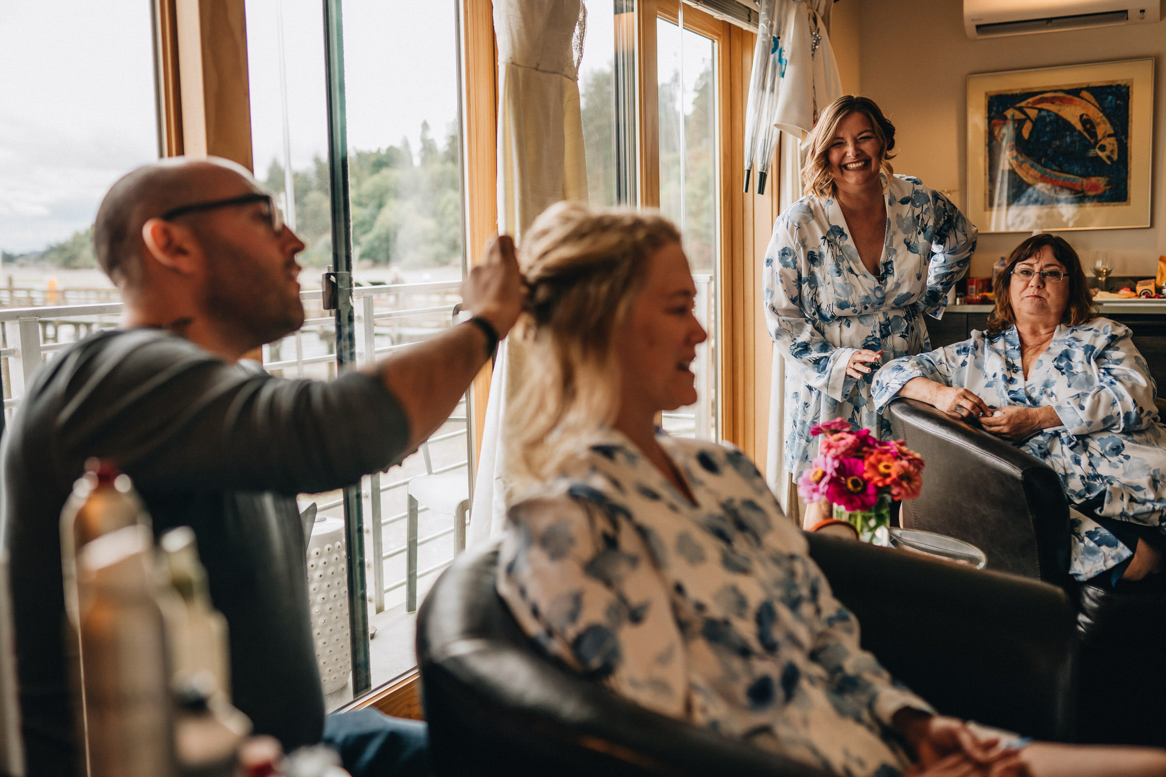 Whidbey Island Wedding: Sara and her ladies chat while getting ready for the wedding at Boatyard Inn