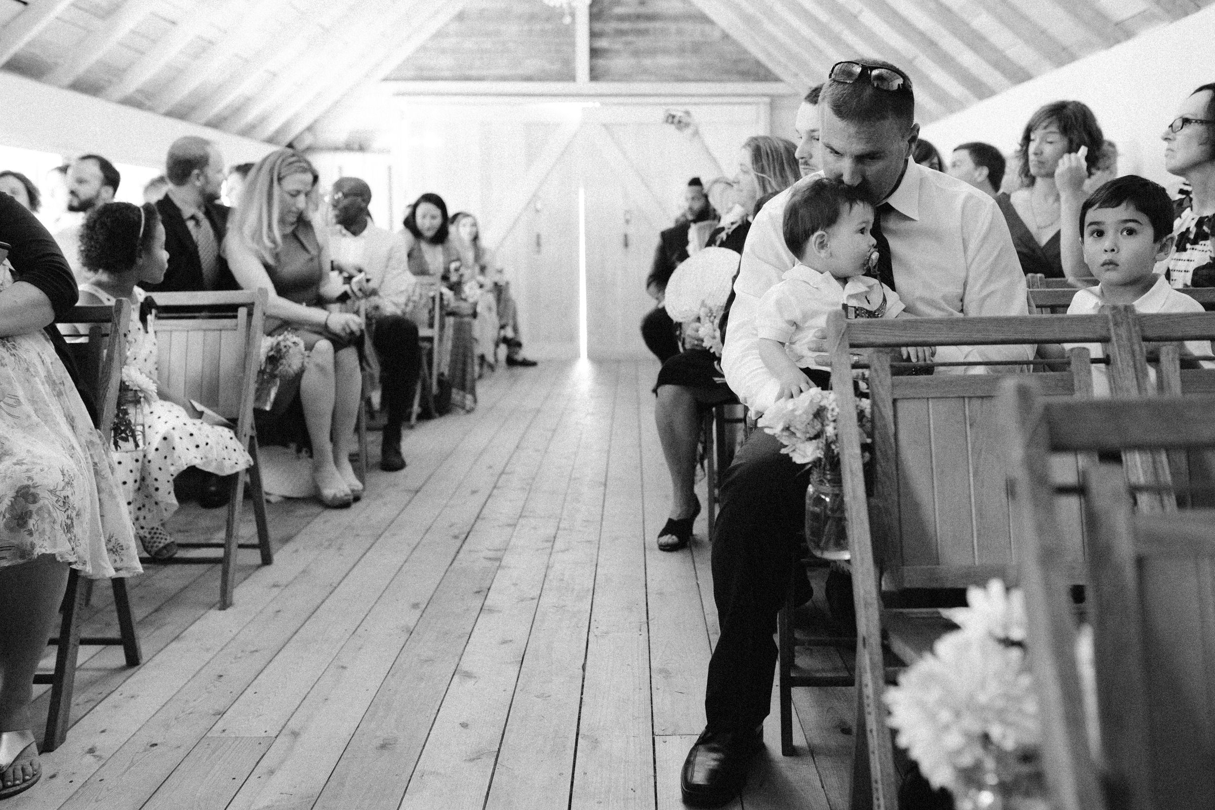 Wayfarer Whidbey Island Wedding: Wedding guests gather at the ceremony barn for Sara and Joe's wedding