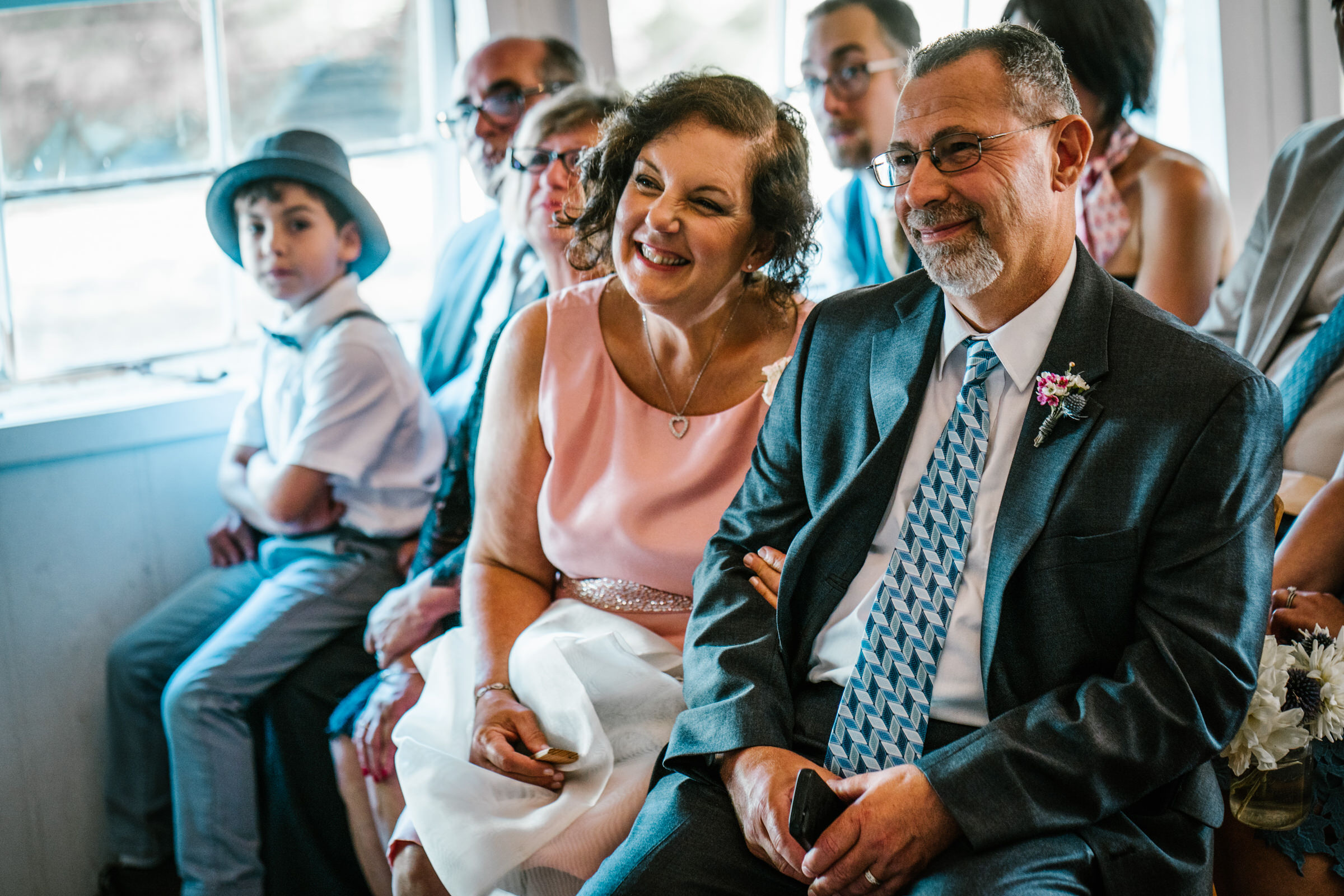 Wayfarer Whidbey Island Wedding: Joe's mom and stepdad smile at the wedding