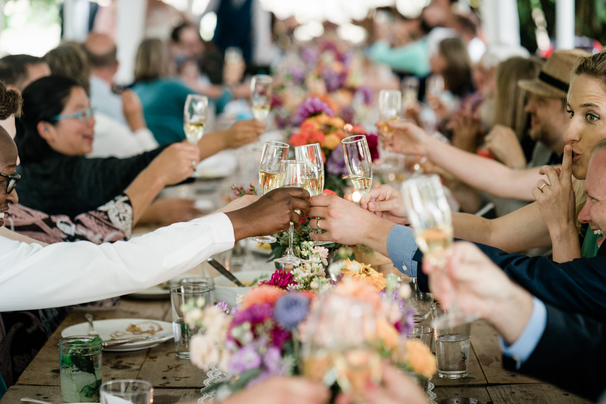 Wayfarer Whidbey Island Wedding: Guests toast to the happy couple