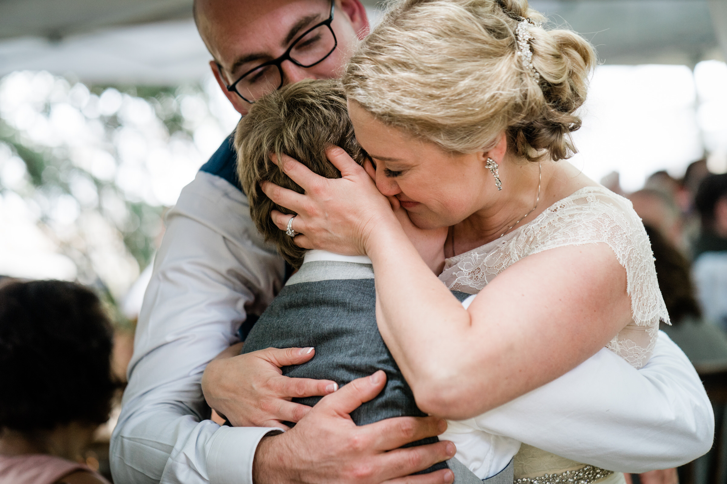 Wayfarer Whidbey Island Wedding: Sara the bride embraces her new stepson after his heartfelt toast 