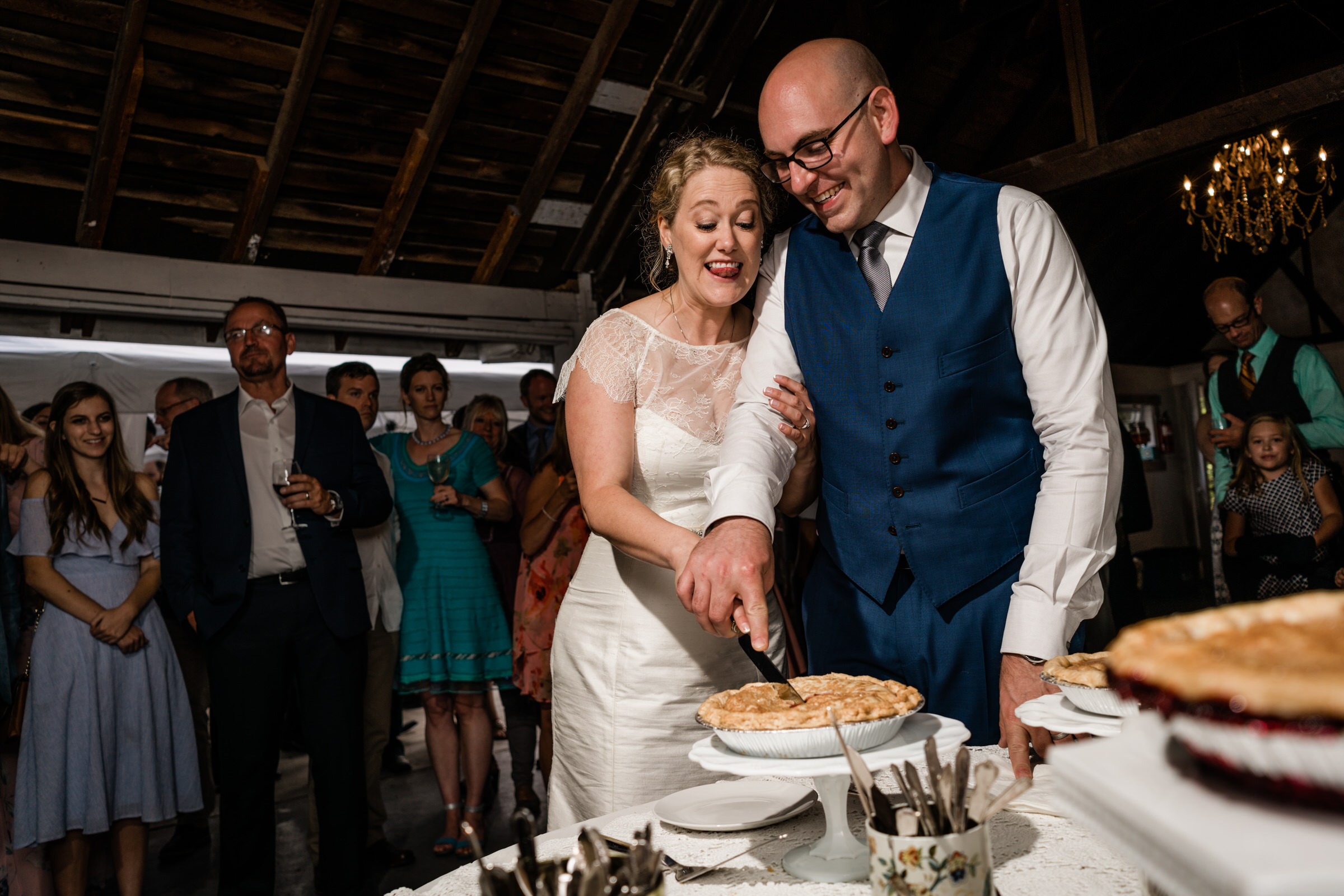 Wayfarer Whidbey Island Wedding: Sara and Joe cut into their wedding pie as husband and wife!