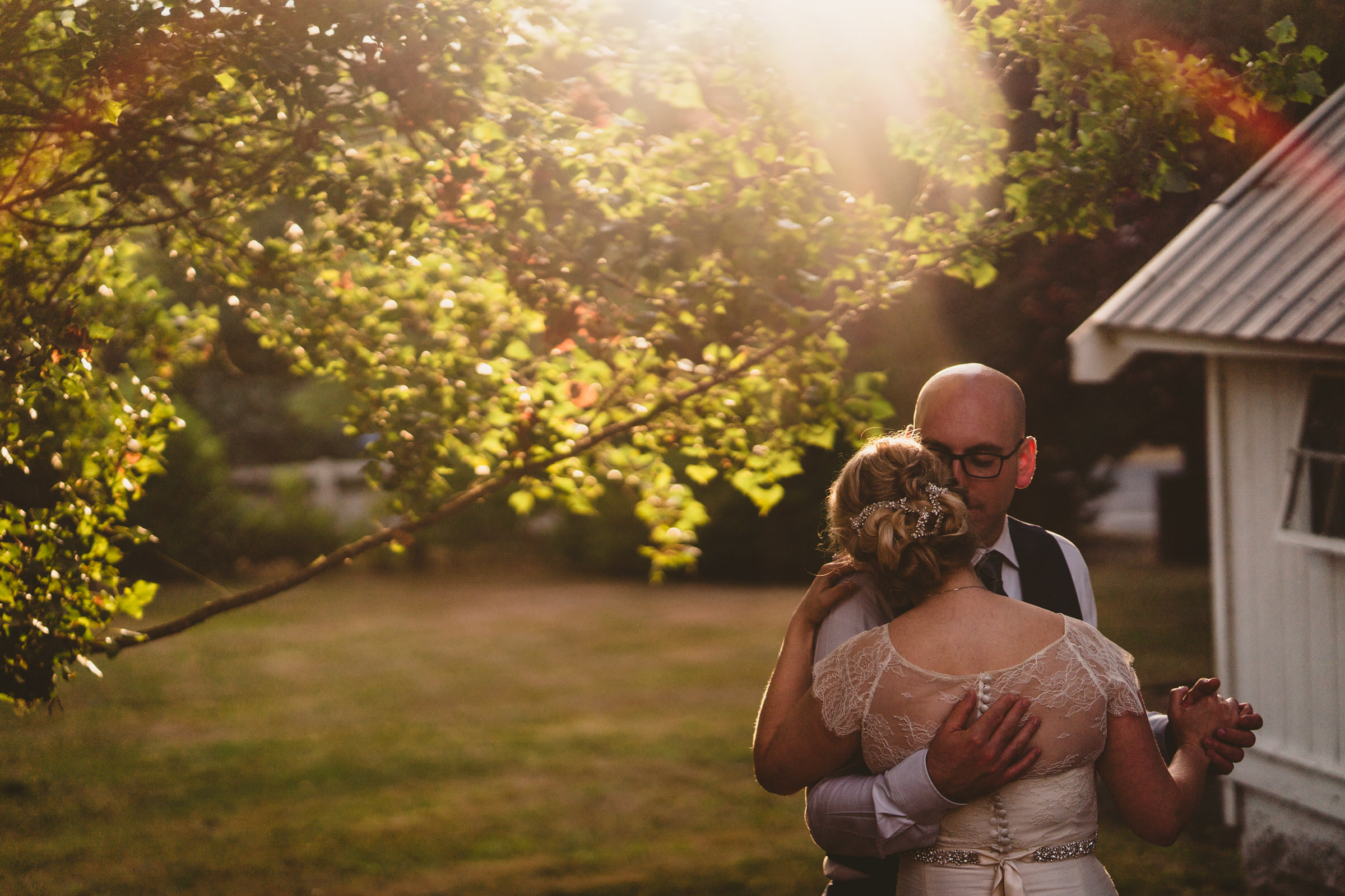 Wayfarer Whidbey Island Wedding: Sara and Joe share a quiet moment away from their reception during golden hour