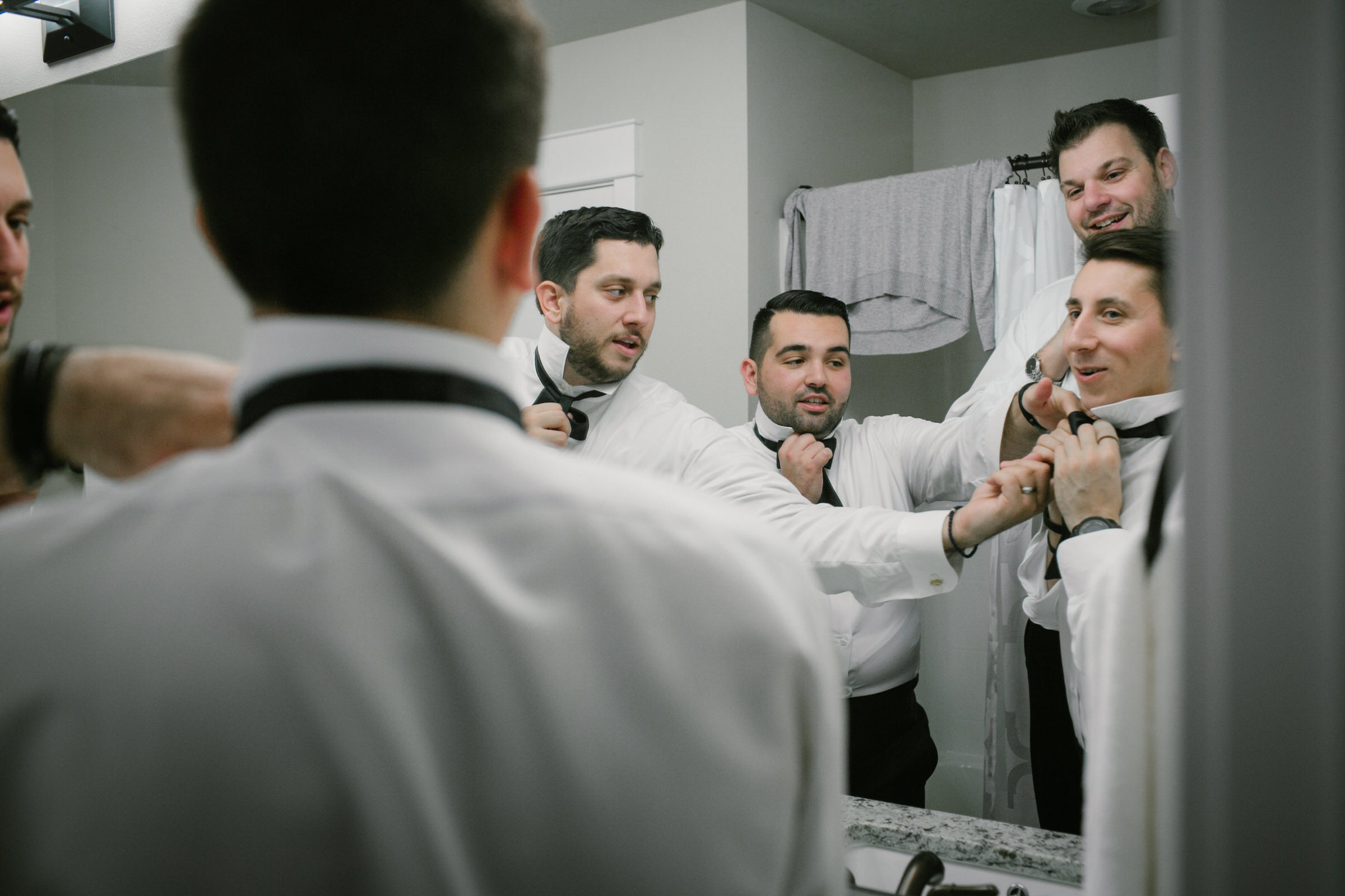 Groomsmen learn how to tie bowties for Nick's big fat greek wedding!