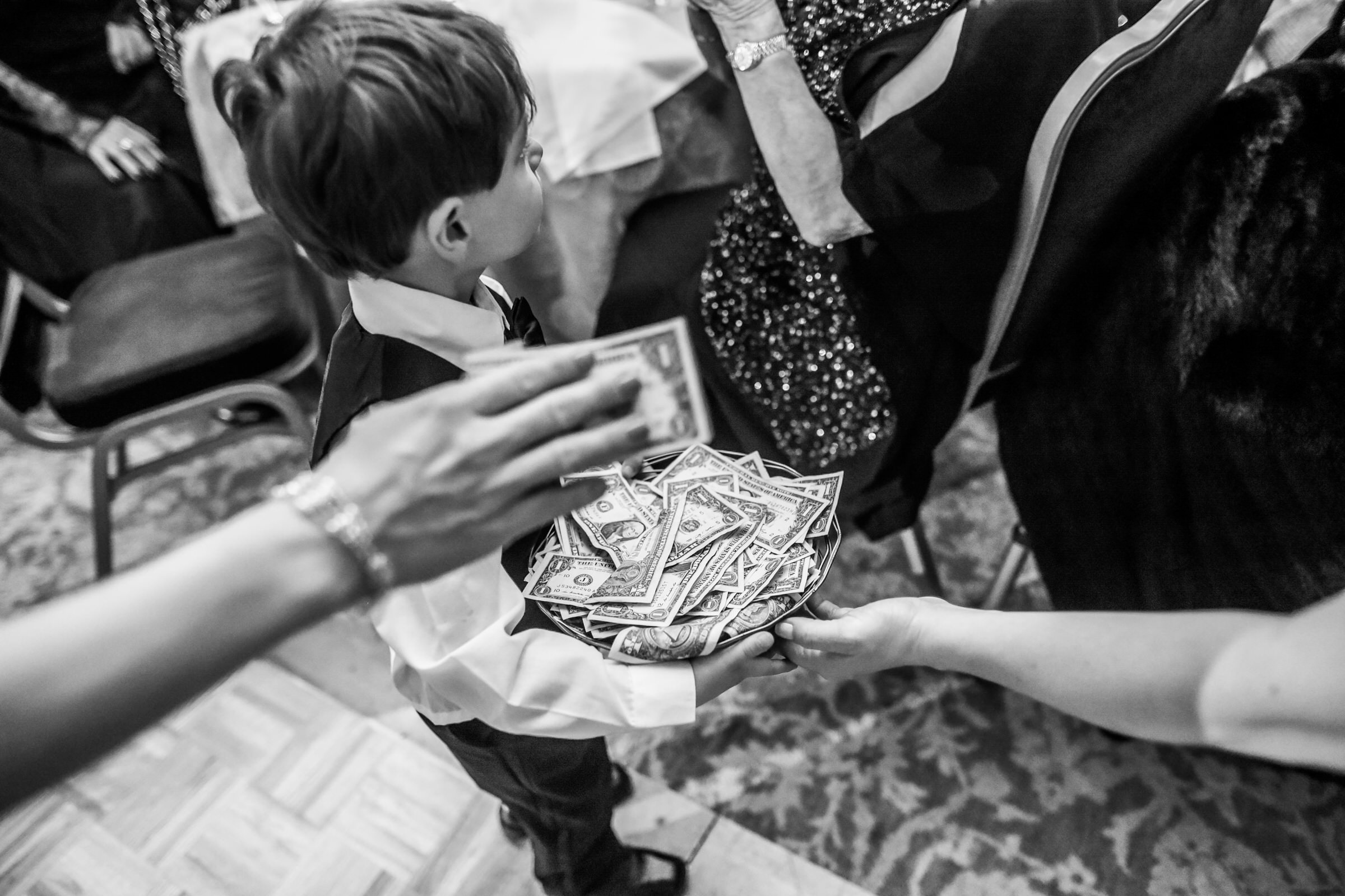 Little dude collecting all the floor money from Nina and Nick's wedding.
