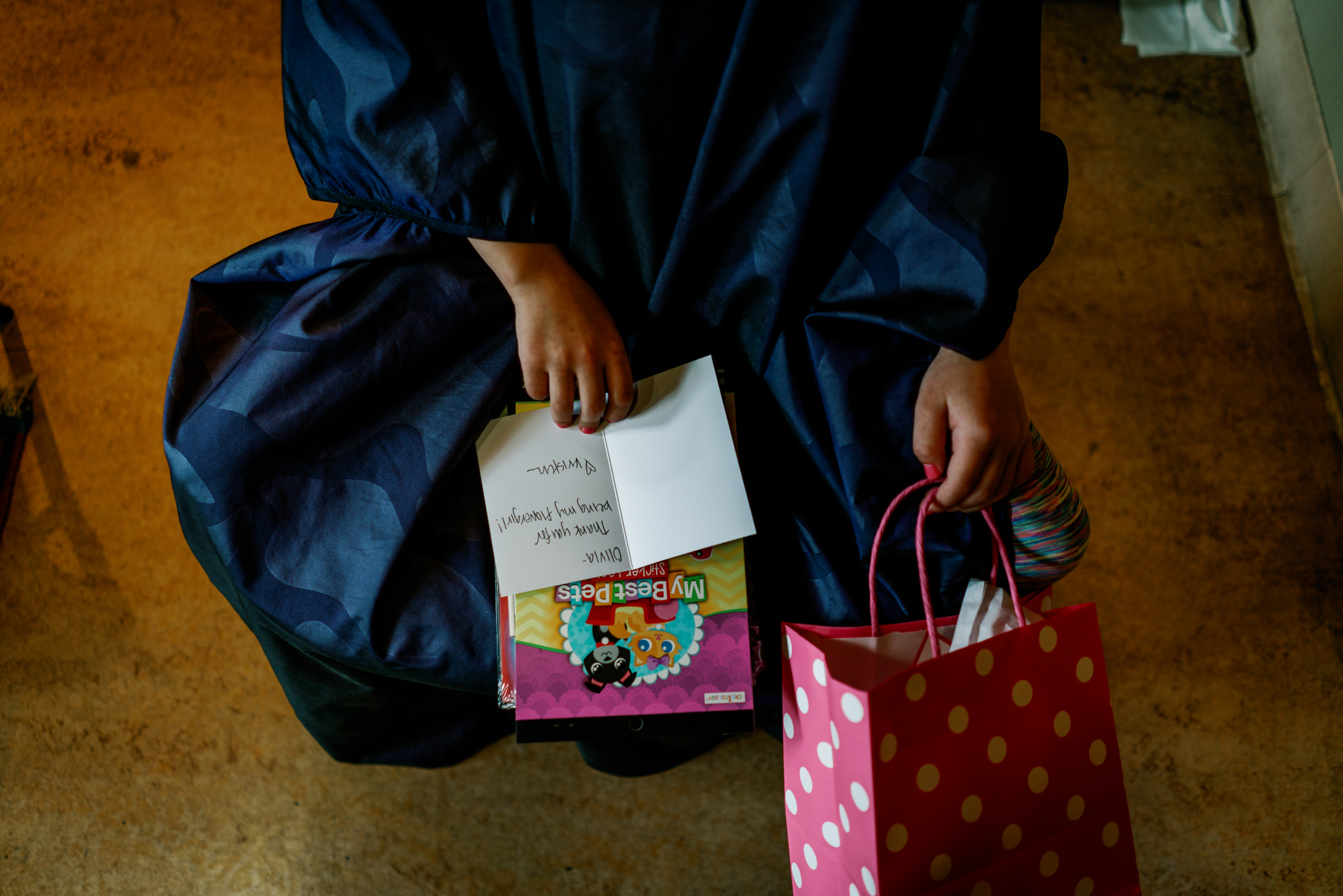 Sleeping Lady Resort weddings: Flower girl looks at her presents
