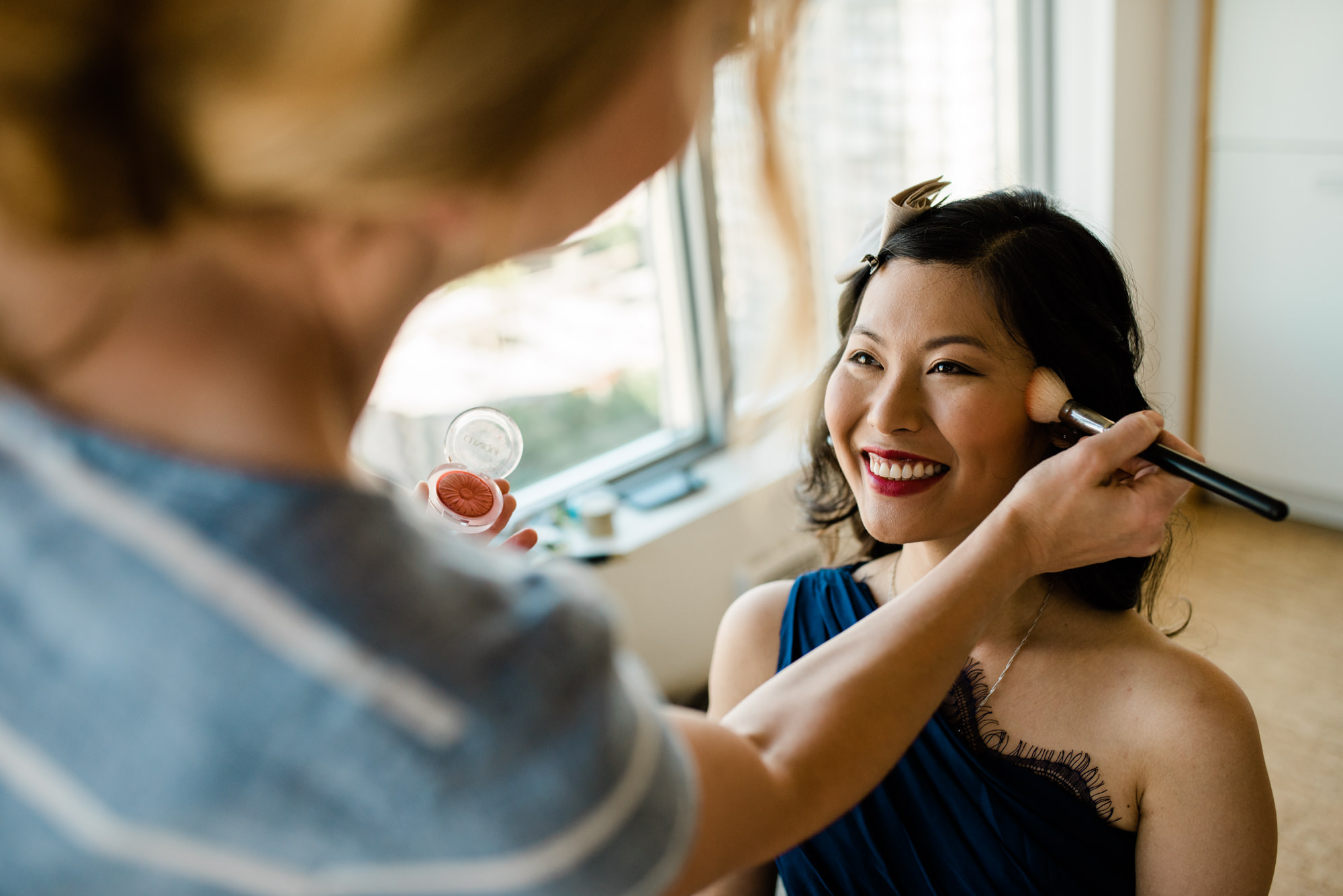 Bridesmaid getting her makeup done