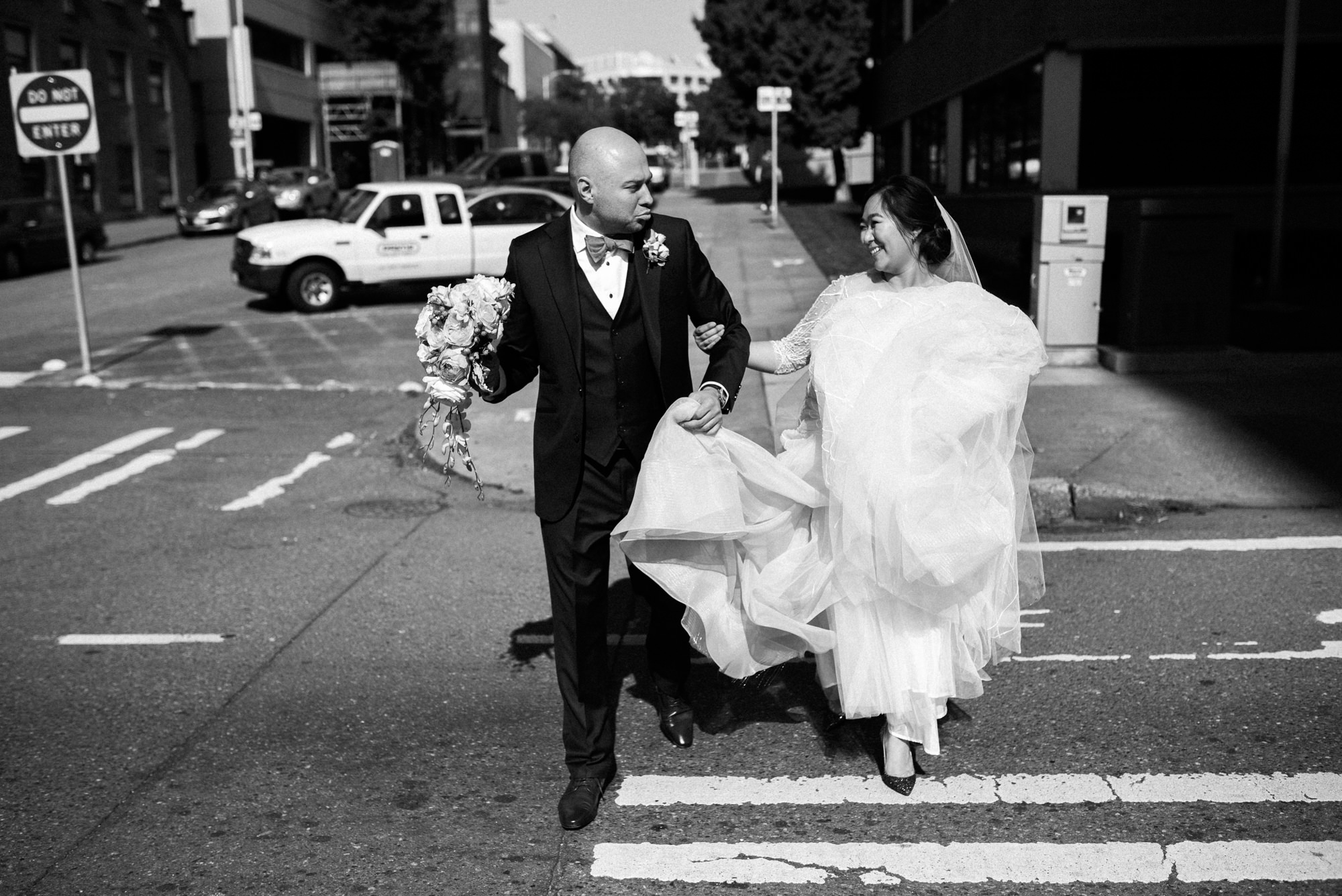 Emma and Joe walking to their wedding venue