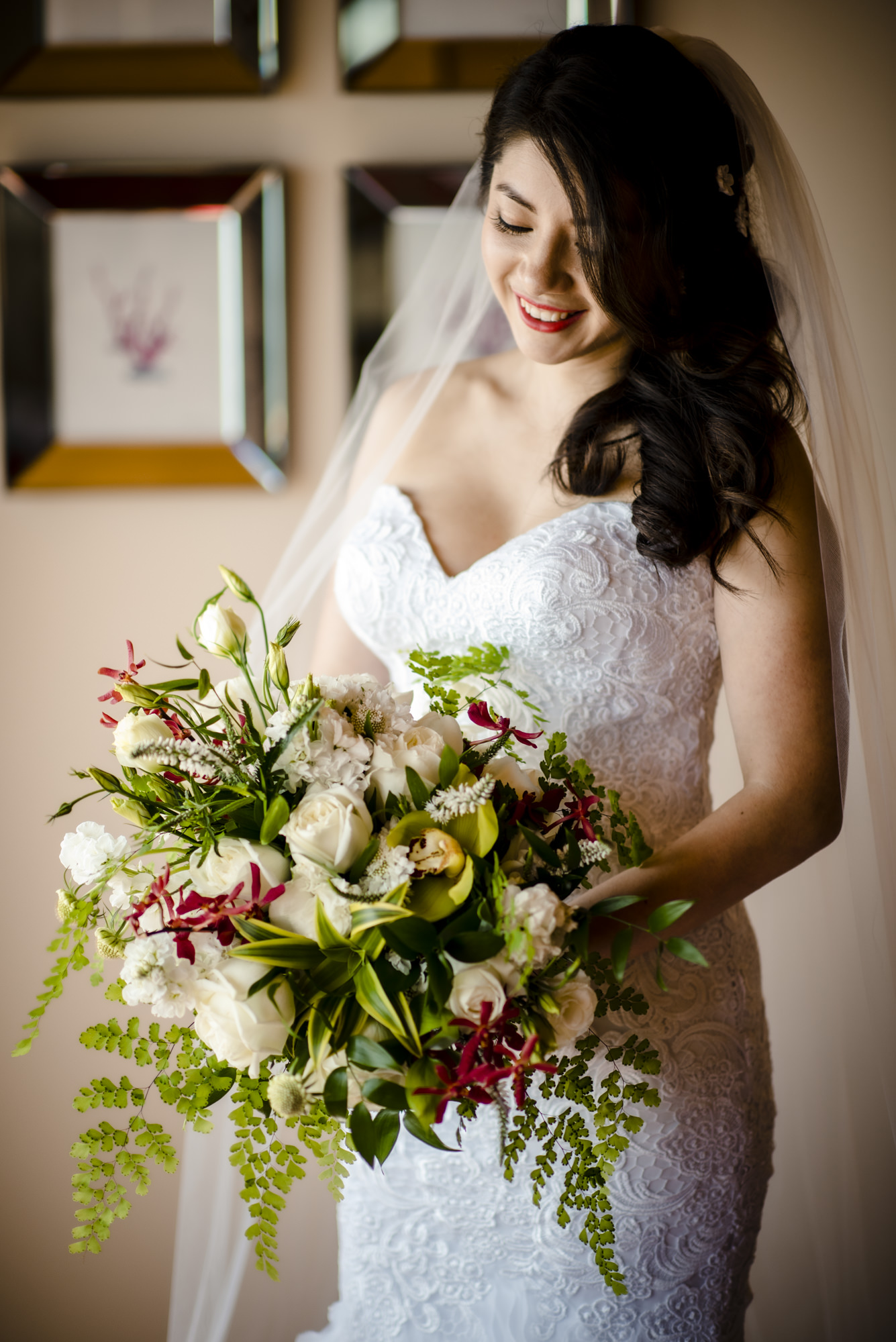 Beautiful bride Kelly and her bridal bouquet in white green and red. Photo by Jenn Tai, Seattle Wedding photographer