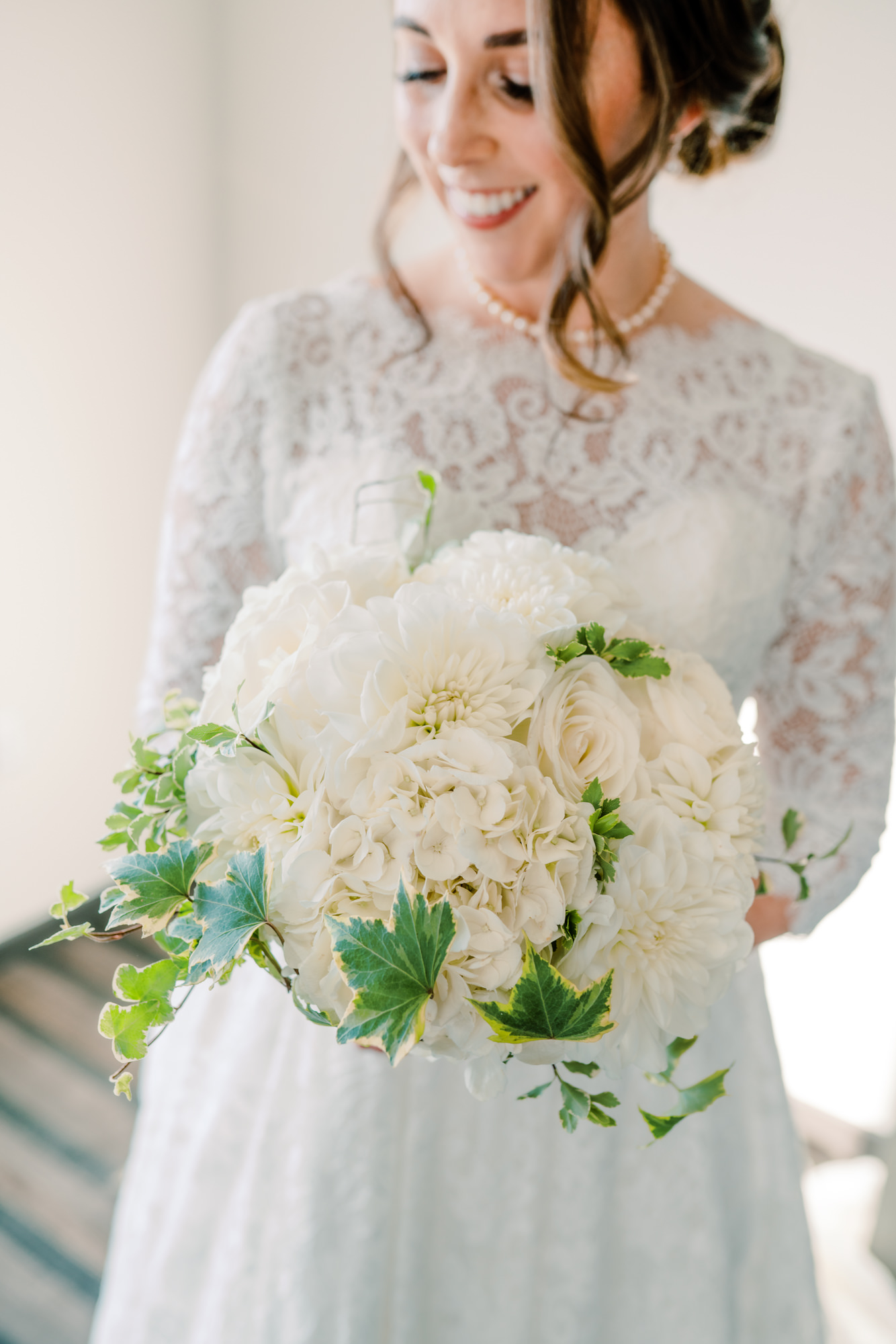 Bride Lauren with her beautiful white and green bouquet