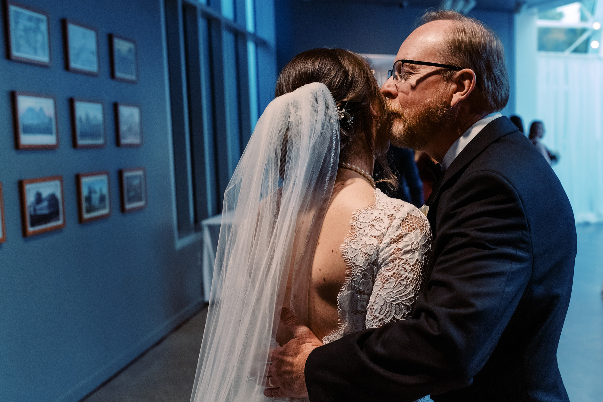 Bride and father share a moment before walking down the aisle