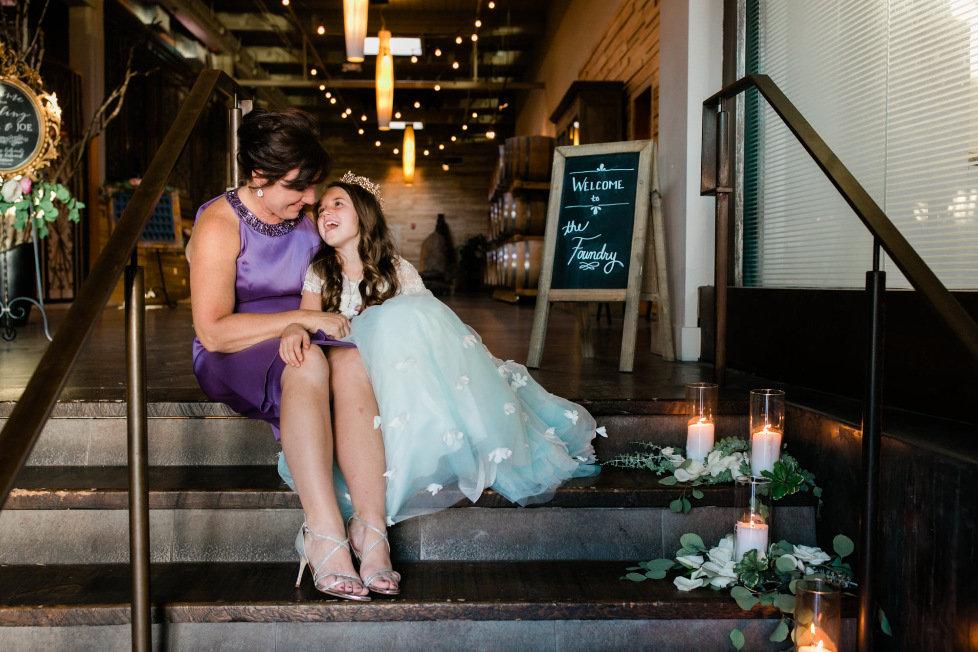 Flower girl with mom having a moment