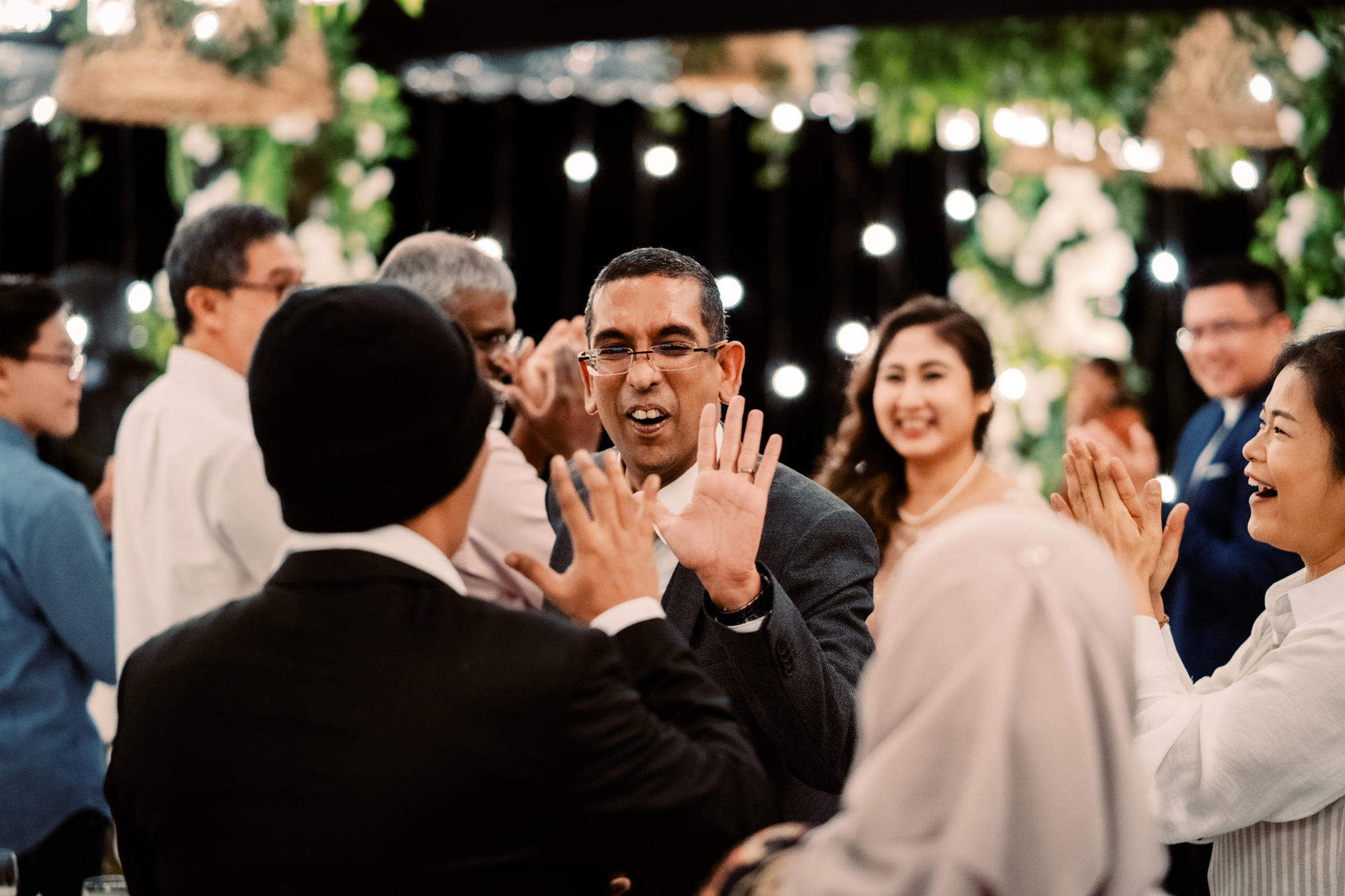 Guests welcome Nadira and Dhillon to their wedding reception at Puncak Dani