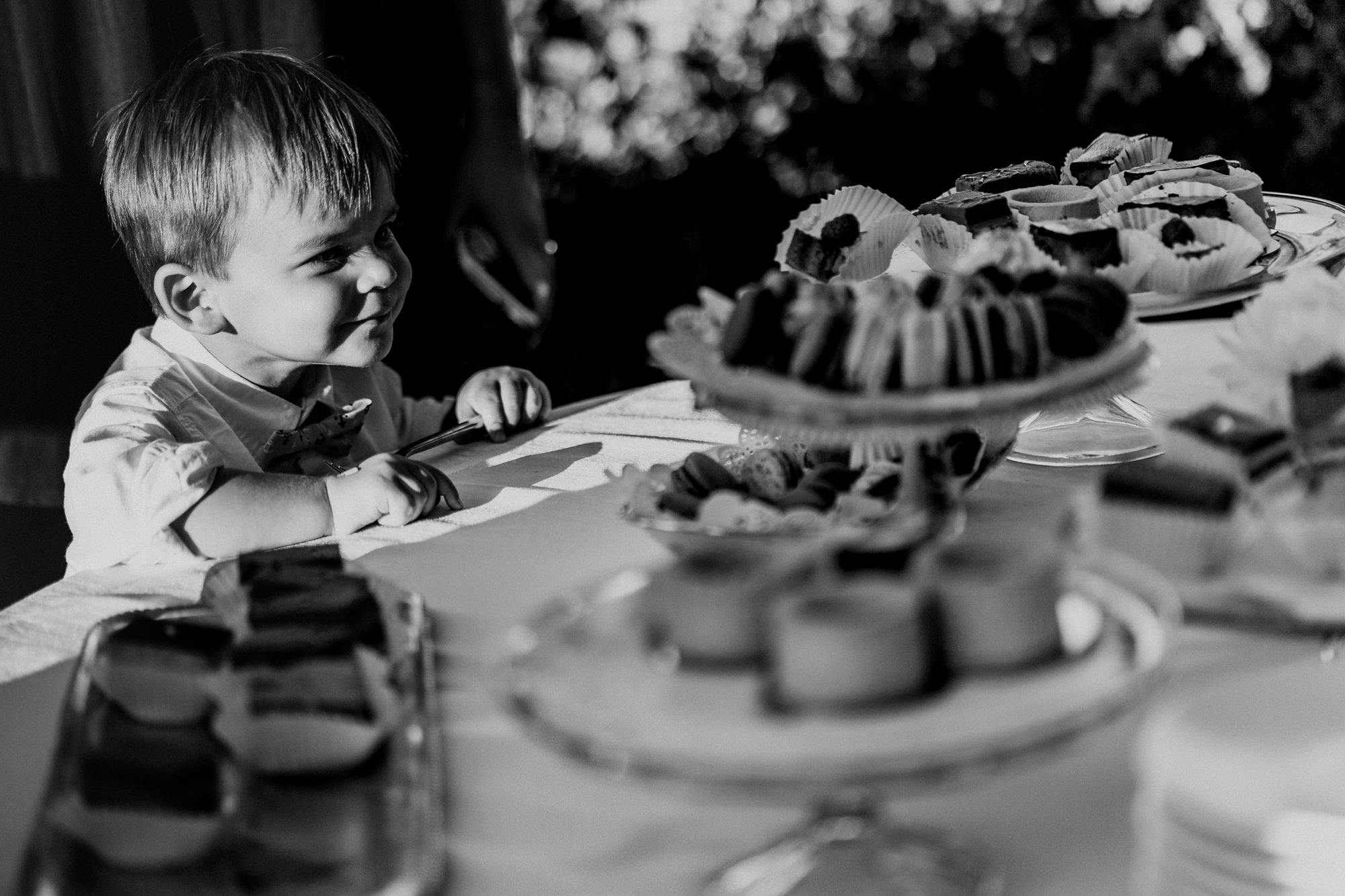 A young guest eyes the dessert table