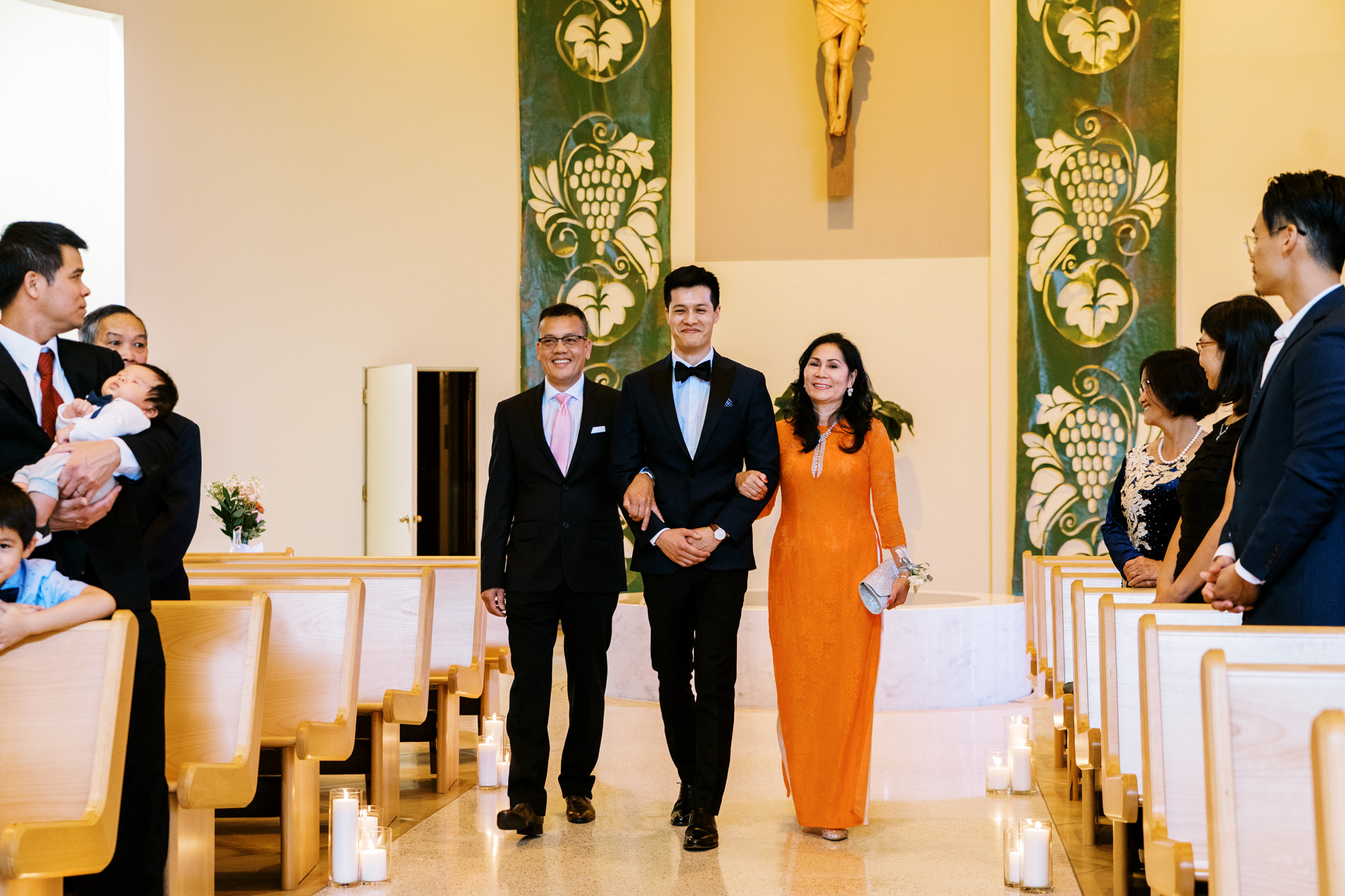 St Anne's Catholic Church wedding: Groom John walks down the aisle with parents