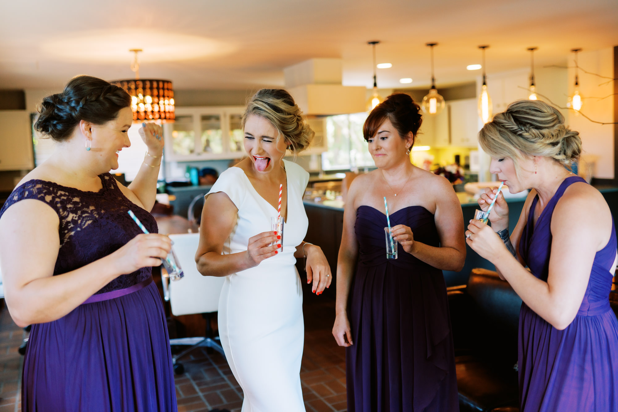 Seattle wedding photographer Jenn Tai: Kayley has a drink with her bridesmaids