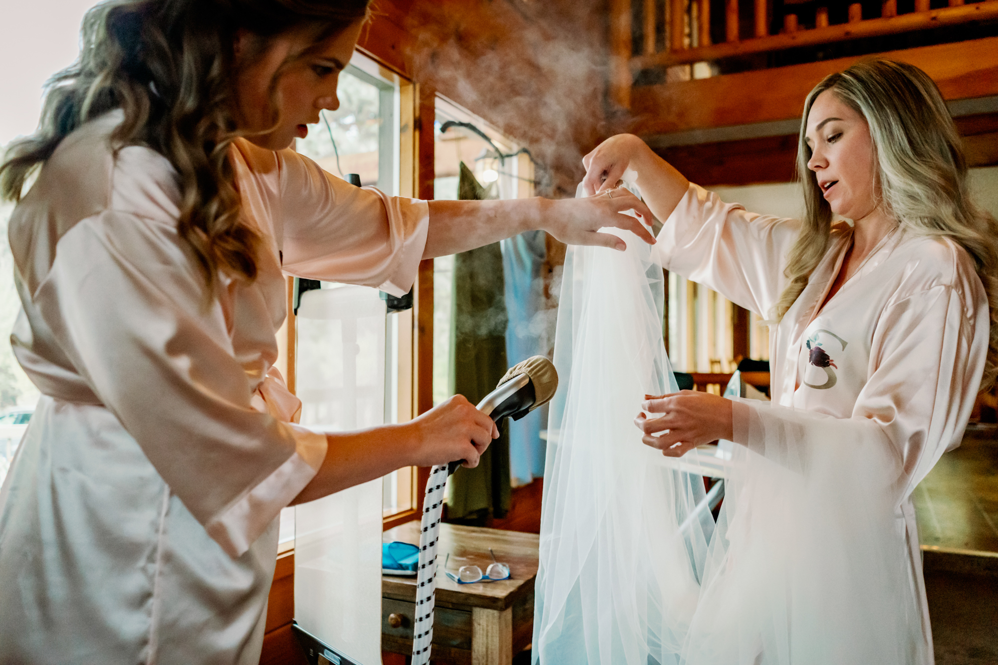Wedding at the Mountain Springs Lodge: Bridesmaids steaming veil