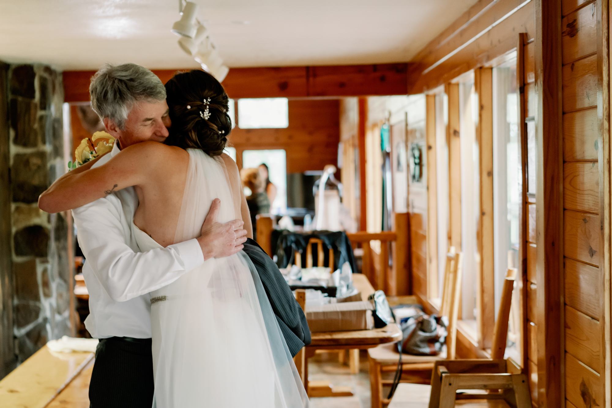 Mountain Springs Lodge weddings: Veronica's dad gives her a hug