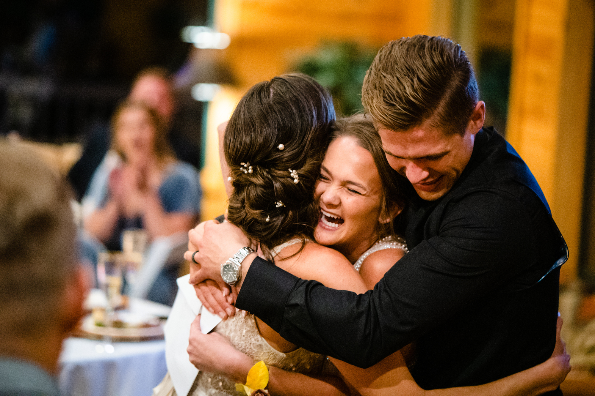 Fletcher and Veronica's friends hug them after their toasts