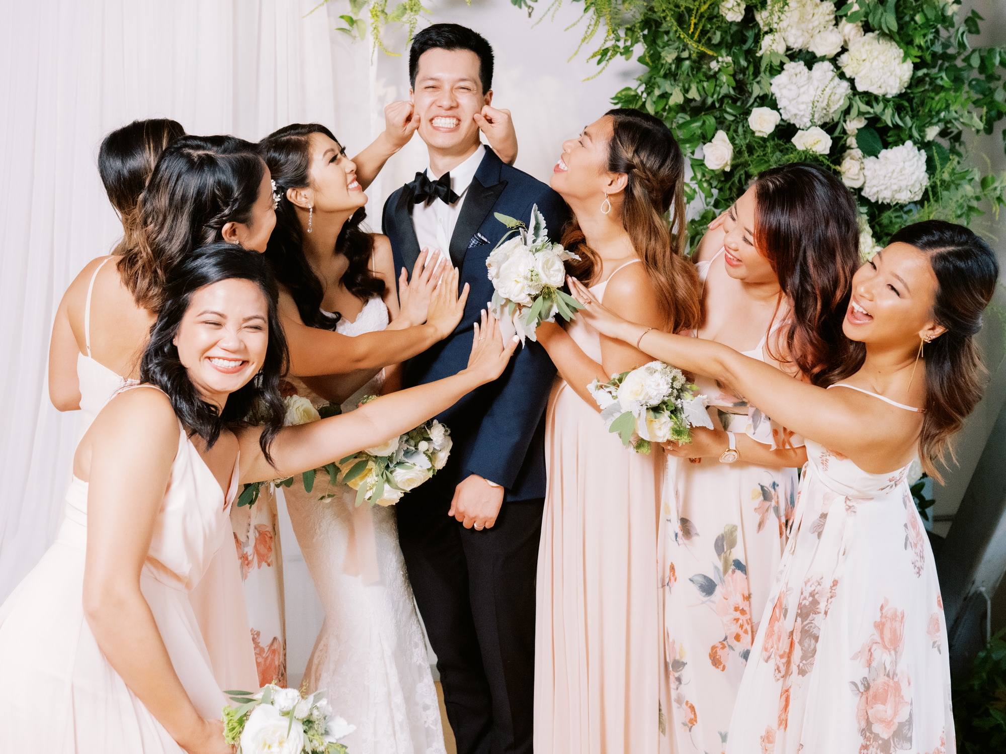 The Metropolist Seattle Weddings: Groom with bridesmaids