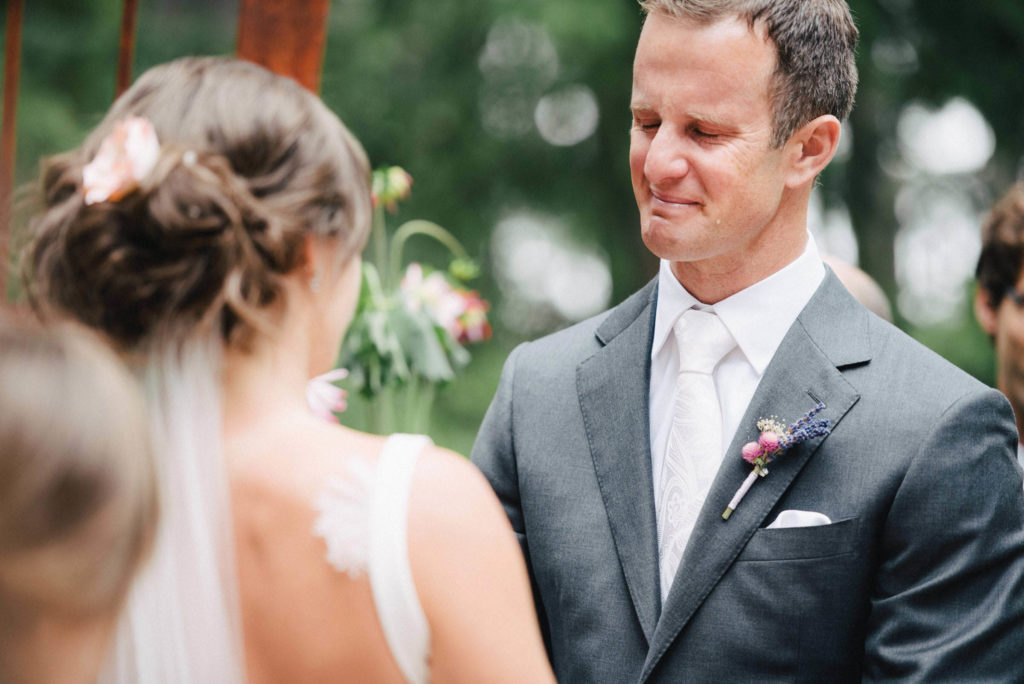 A groom crying during an outdoor wedding ceremony - Jenn Tai & Co - Seattle wedding photography