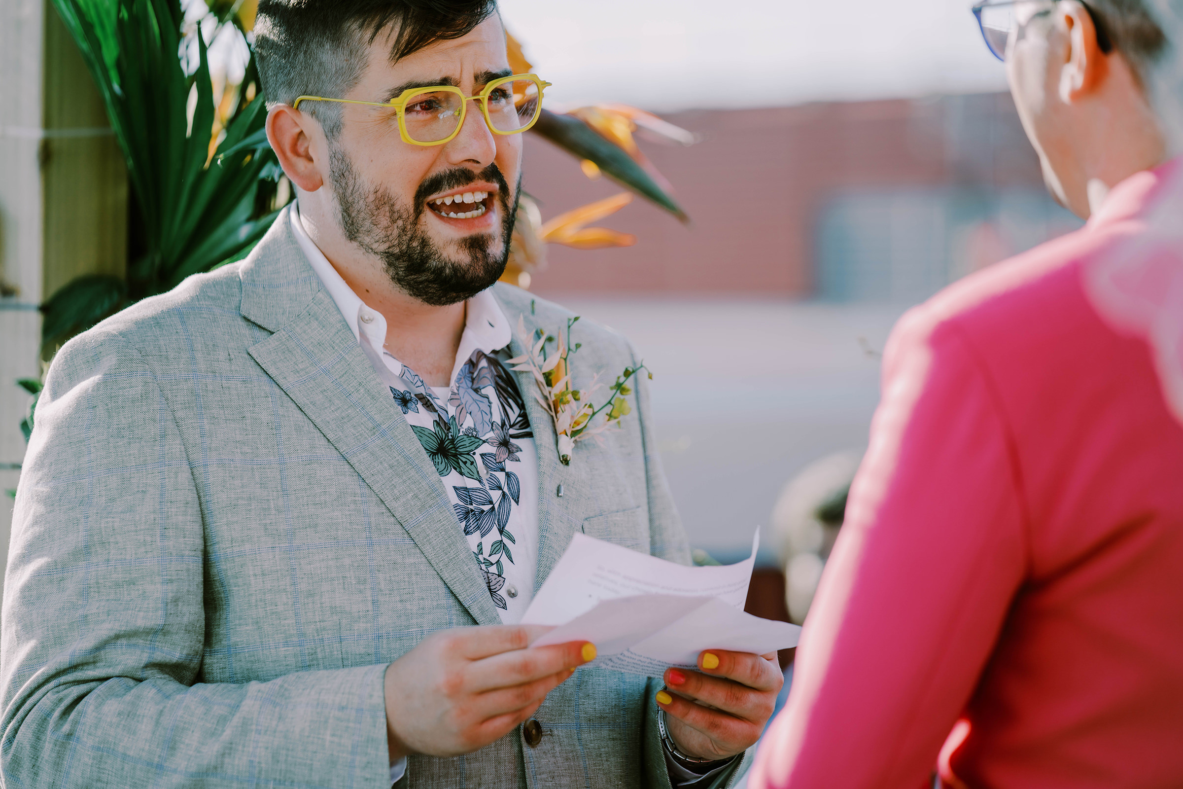 Joey says his vows to Dustin at their wedding on the Bell Harbor Conference Center rooftop, summer 2022