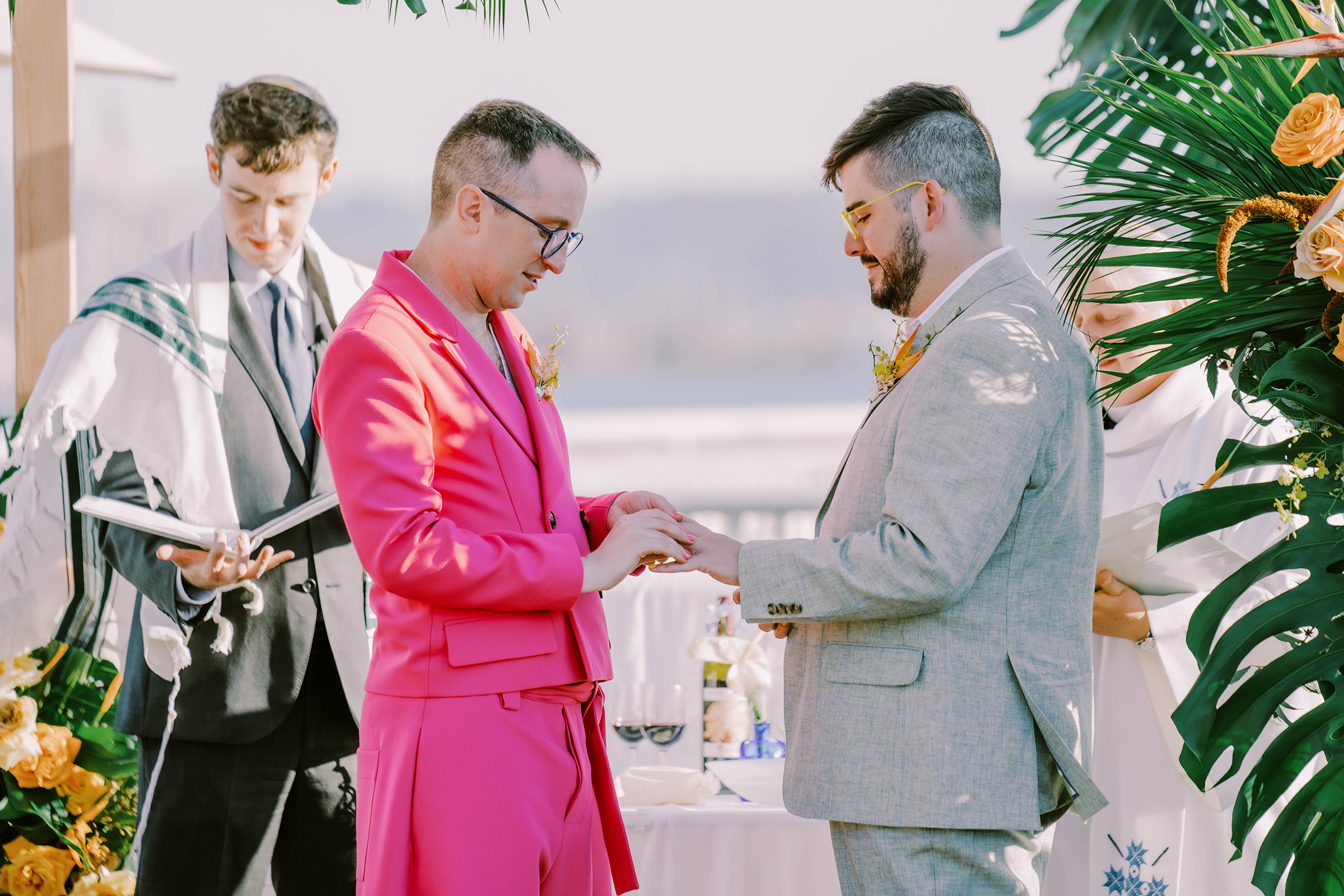 Dustin and Joey exchange rings at their Bell Harbor Conference Center rooftop wedding, summer 2022