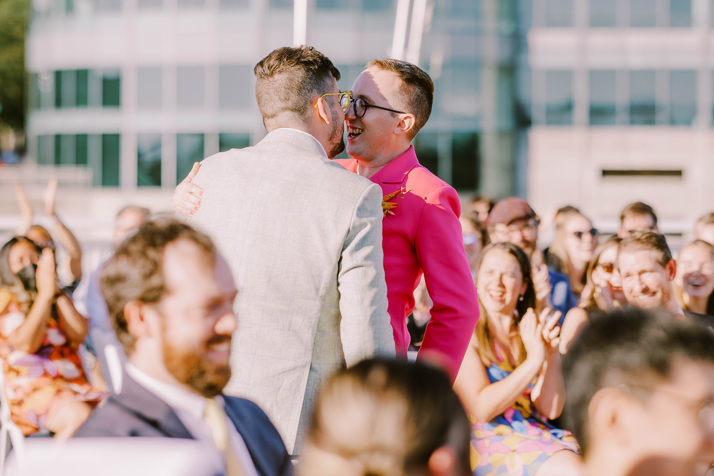 Dustin and Joey seal it with a kiss at their Bell Harbor Conference Center rooftop wedding, summer 2022
