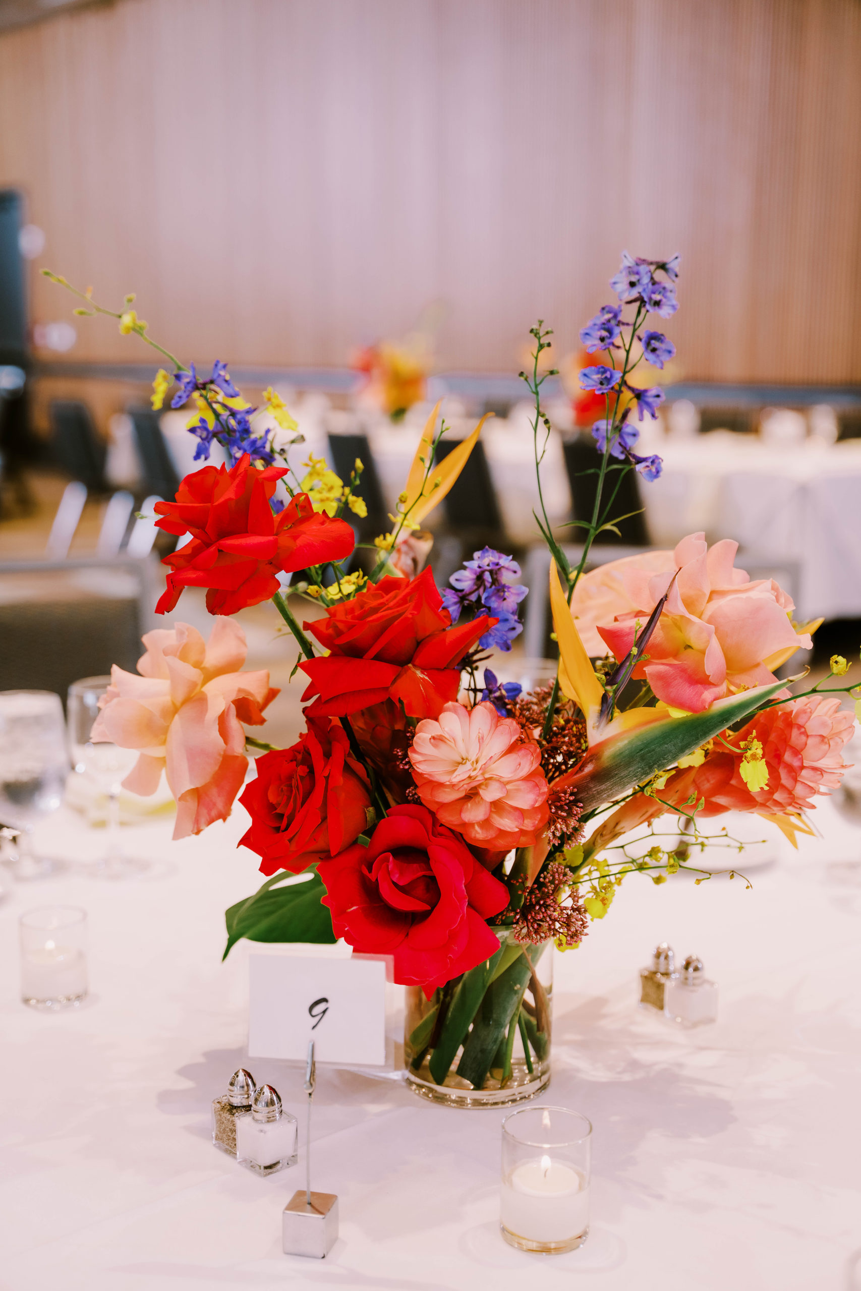 Joey and Dustin's wedding reception at the Bell Harbor Conference Center ballroom, florals by Bahtoh, designed and planned by Emerald Engagements