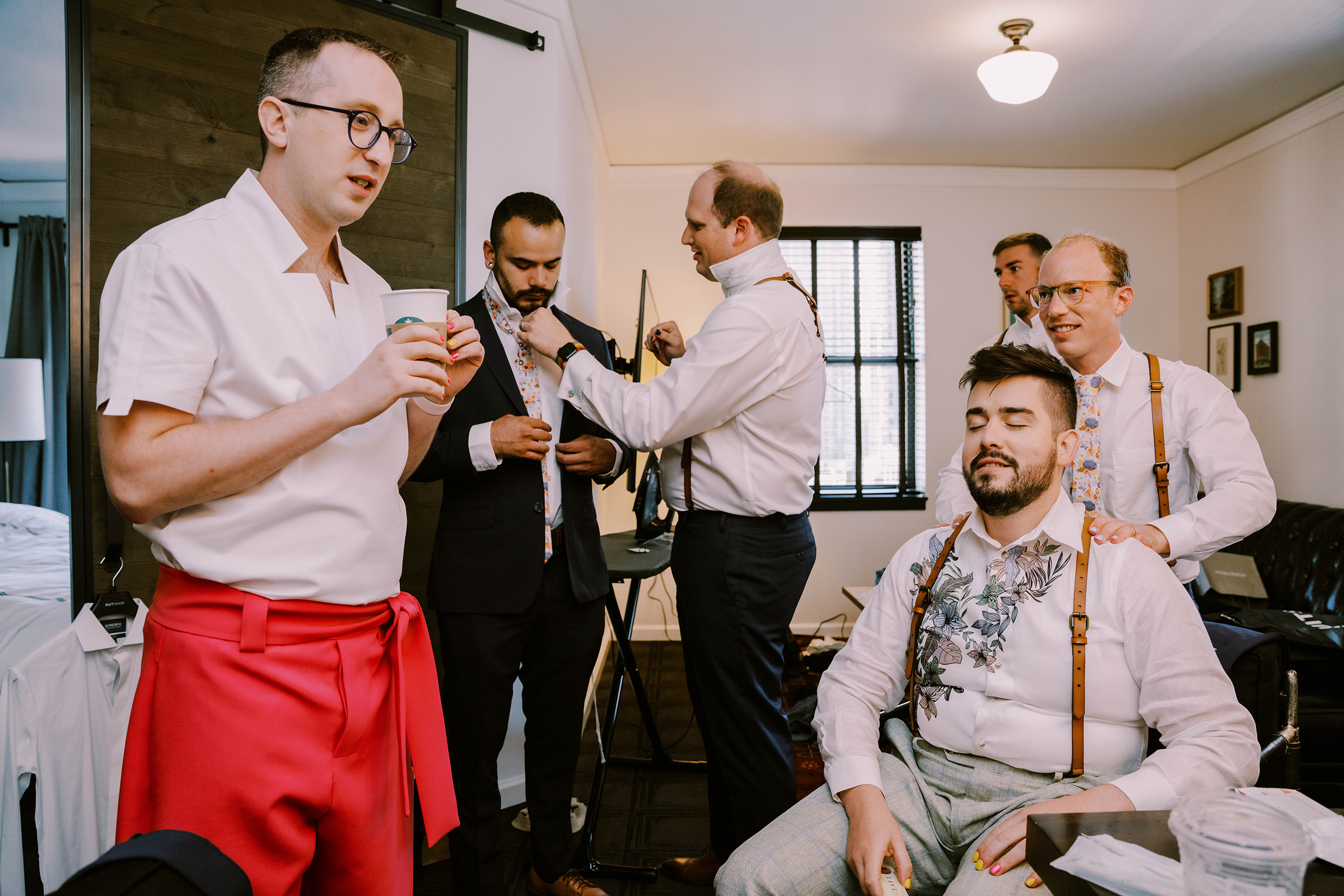 Joey and Dustin get ready at The Palladian Hotel in Seattle for their wedding, summer 2022
