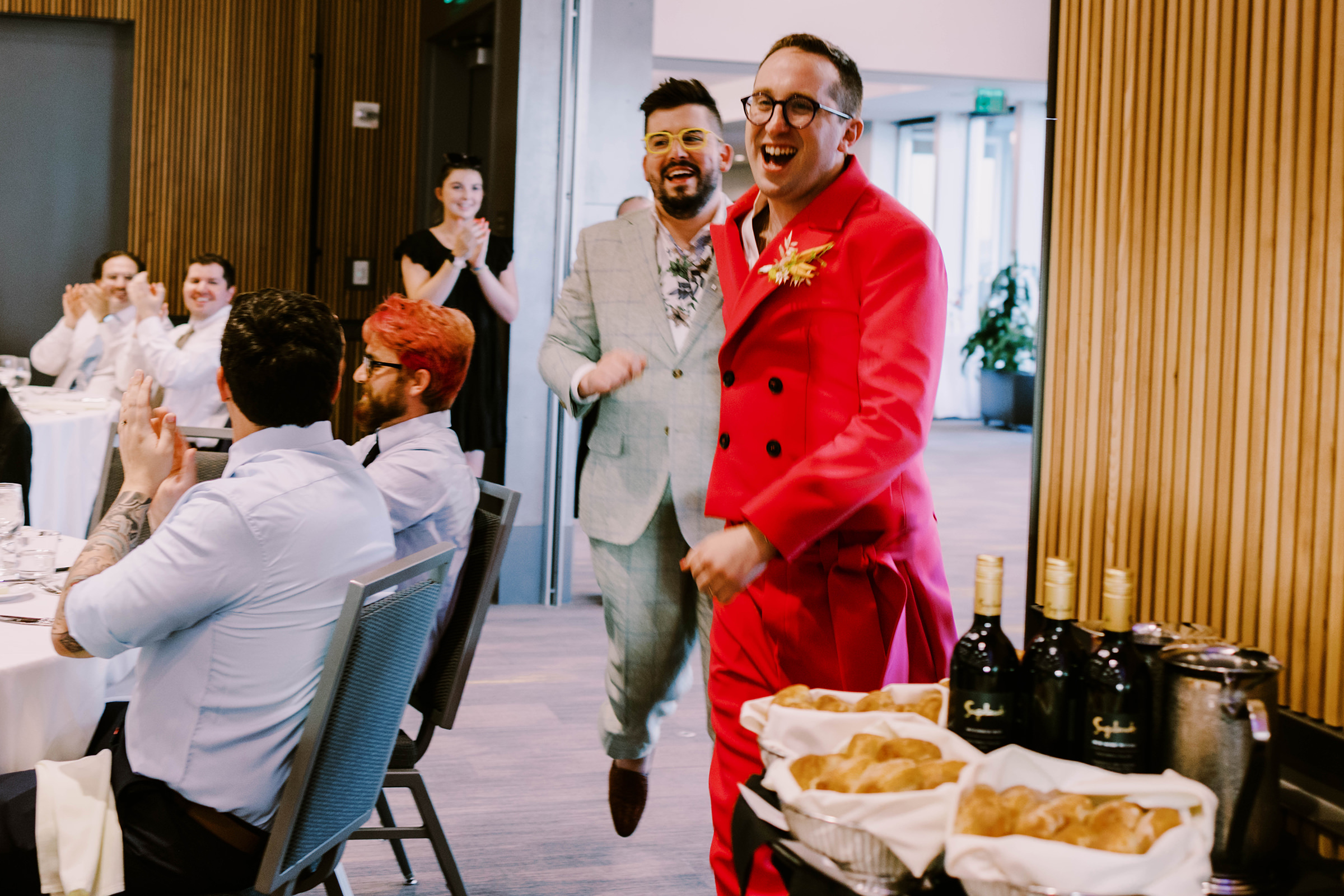 Joey and Dustin's entrance to their wedding reception at Bell Harbor Conference Center, summer 2022