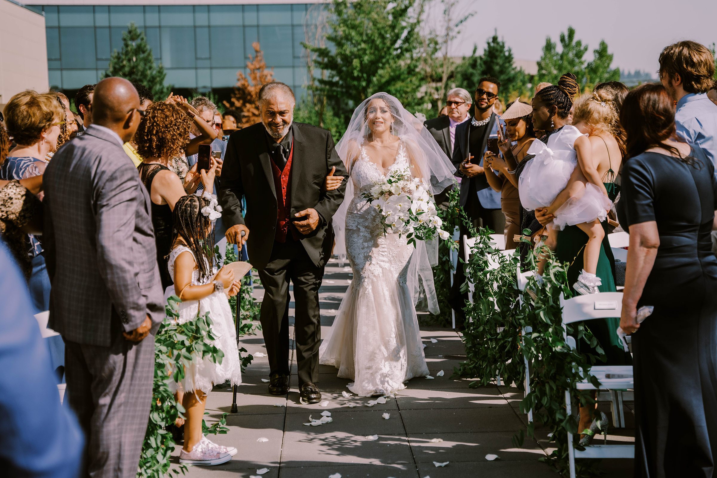 Kasi and her dad walk down the aisle at her wedding at Hyatt Regency Lake Washington Seattle Southport, Summer 2022